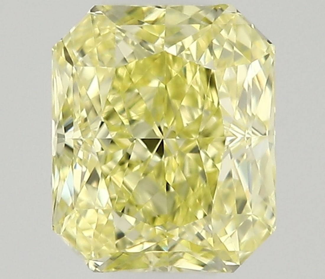 Radiant 0.31ct Fancy Yellow VVS1 - Loose Natural Diamond: Radiant 0.31ct Fancy Yellow VVS1 - Loose Natural Diamond The 0.31ct Fancy Yellow VVS1 diamond boasts a vibrant, sunny hue and exceptional clarity, with a high level of polish and symmetry. Its