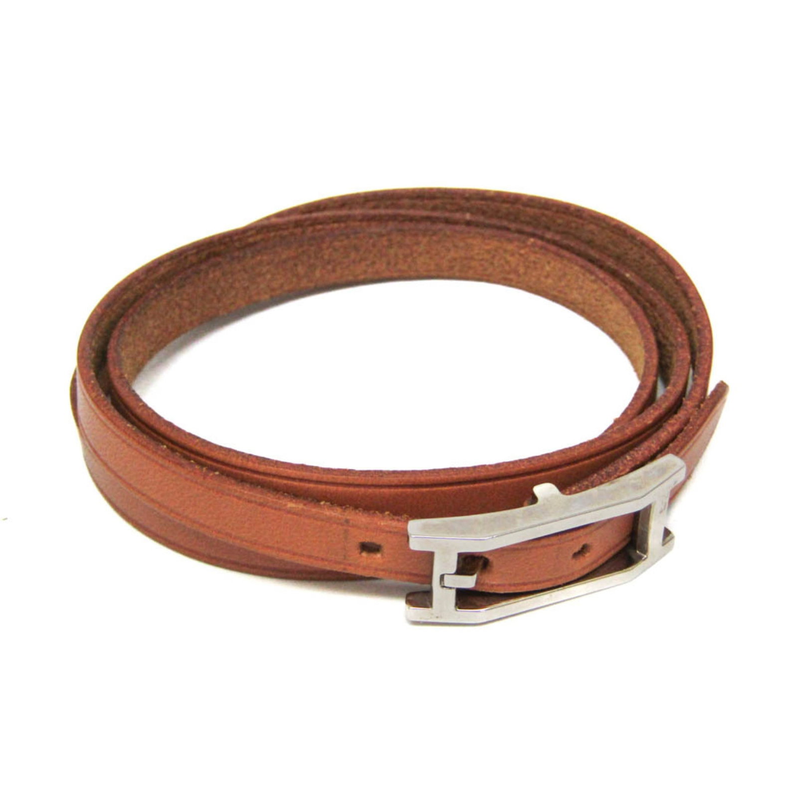 HERMES Bangle Leather Metal: HERMES Bangle Leather Metal The Hermes Bangle Leather Metal is a stylish and elegant accessory, featuring a combination of rich brown leather and silver accents. Measuring 19-20.5cm in length, this ba
