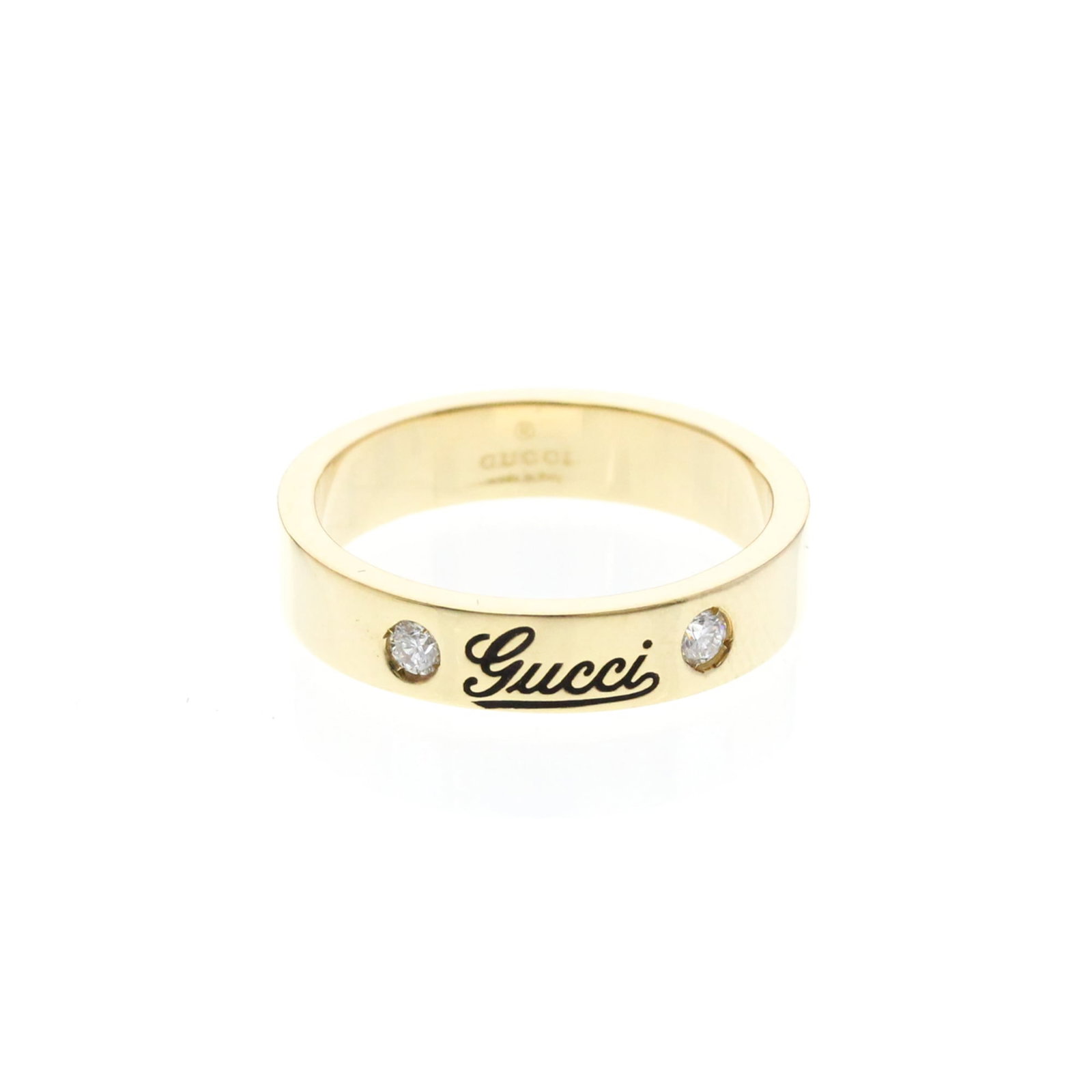 GUCCI Band Ring Yellow Gold (18K): GUCCI Band Ring Yellow Gold (18K) Yellow gold (18K) band ring from Gucci features an iconic print design and two diamonds, adding a touch of elegance to any outfit. This 18K gold ring is made from