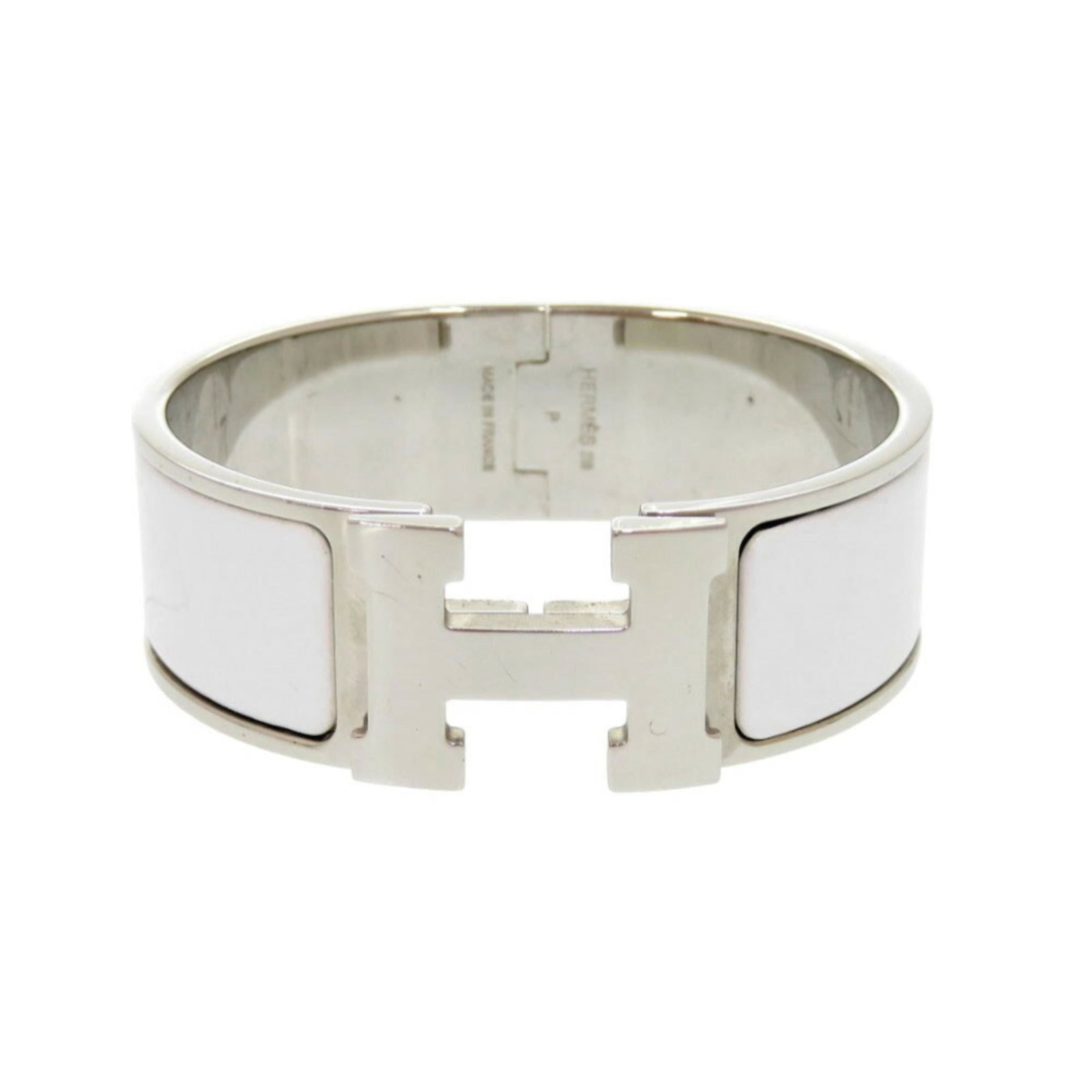 HERMES Bangle Metal: HERMES Bangle Metal Silver and White Hermes Bangle Metal, 16cm / 6.29'' in length, features a metal design with visible scratches, scuffs, and dirt. This bangle is made of metal and bears a
