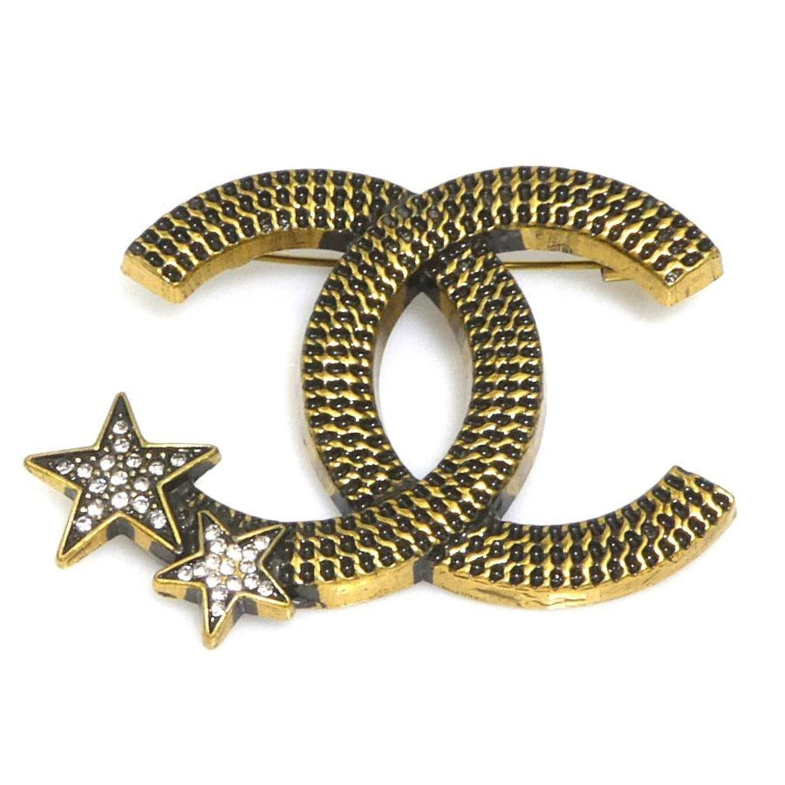 CHANEL Brooch Metal Rhinestone: CHANEL Brooch Metal Rhinestone Metal rhinestone brooch in gold and silver tones, a classic Chanel design. This 3.5cm x 5.5cm brooch features visible wear and scratches, showcasing its well-worn condit