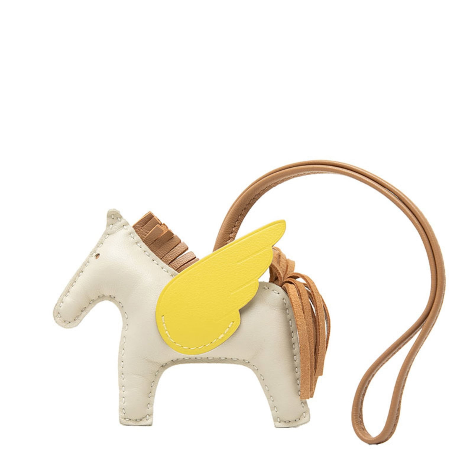 HERMES Handbag Charm Agneau Milo: HERMES Handbag Charm Agneau Milo Agneau Milo, a signature Herm?s handbag charm, adds a touch of elegance to any bag. This beautifully crafted charm features a unique design and bears a signature,