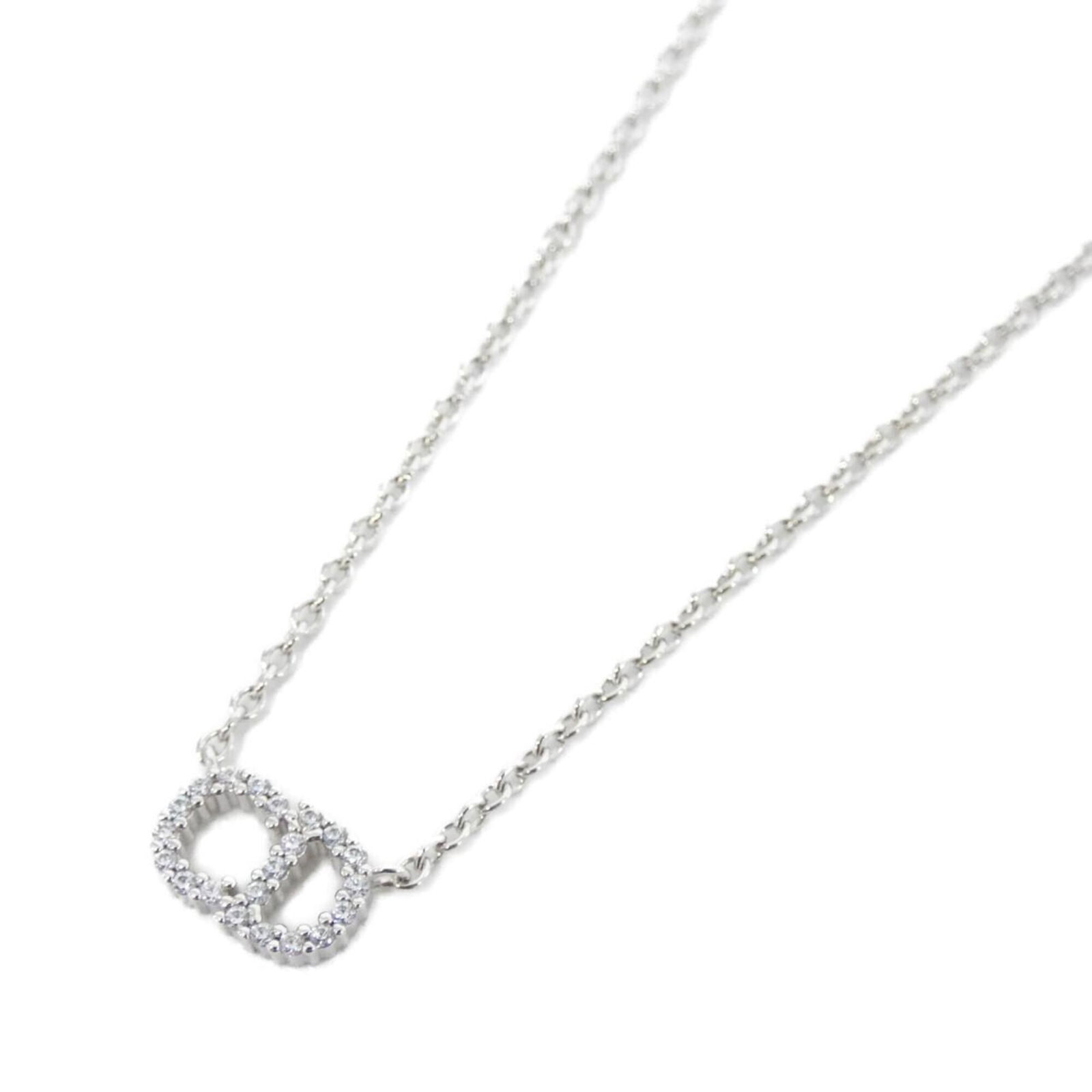 CHRISTIAN DIOR Clear Silver: CHRISTIAN DIOR Clear Silver Clear Silver Necklace by Christian Dior, featuring a 7mm x 12mm pendant in a delicate design, is a beautiful addition to any jewelry collection. Gently used with minor