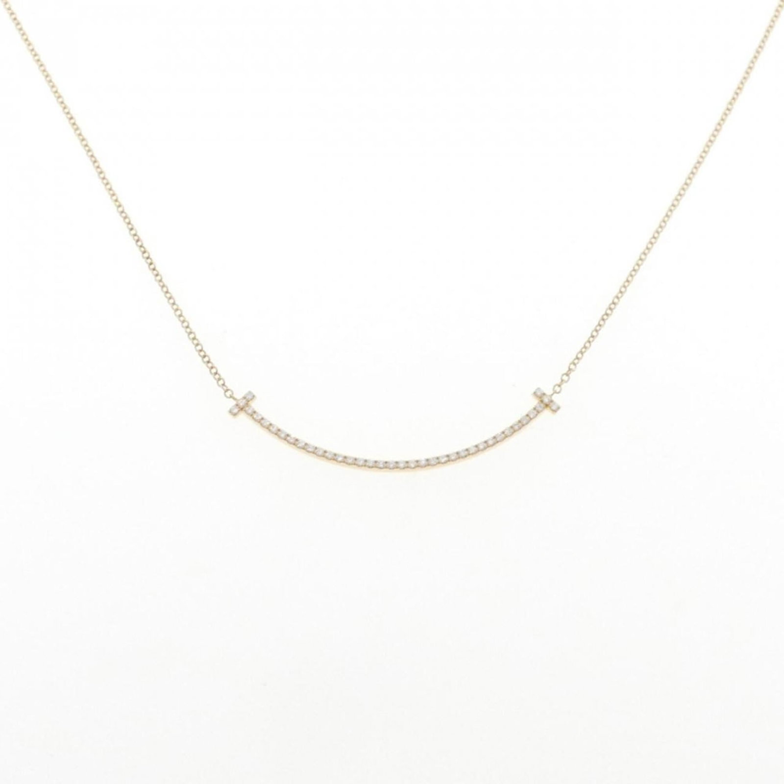 TIFFANY Yellow Gold (18K): TIFFANY Yellow Gold (18K) Yellow gold (18K) pendant from Tiffany, featuring a 3.5mm x 37.1mm design, suspended from a 41 cm / 16.14'' necklace. This necklace is in like new condition, with only the