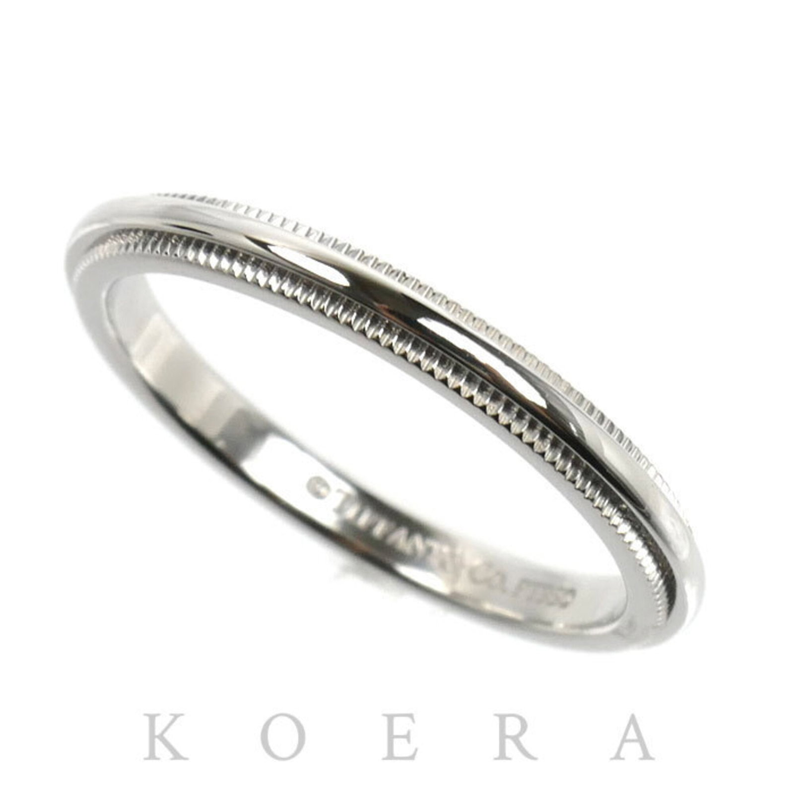 TIFFANY Band Ring Platinum 950: TIFFANY Band Ring Platinum 950 Platinum 950 Tiffany & Co. band ring in excellent condition, featuring a classic design with a subtle shine. This gently used ring shows minor signs of wear, with small