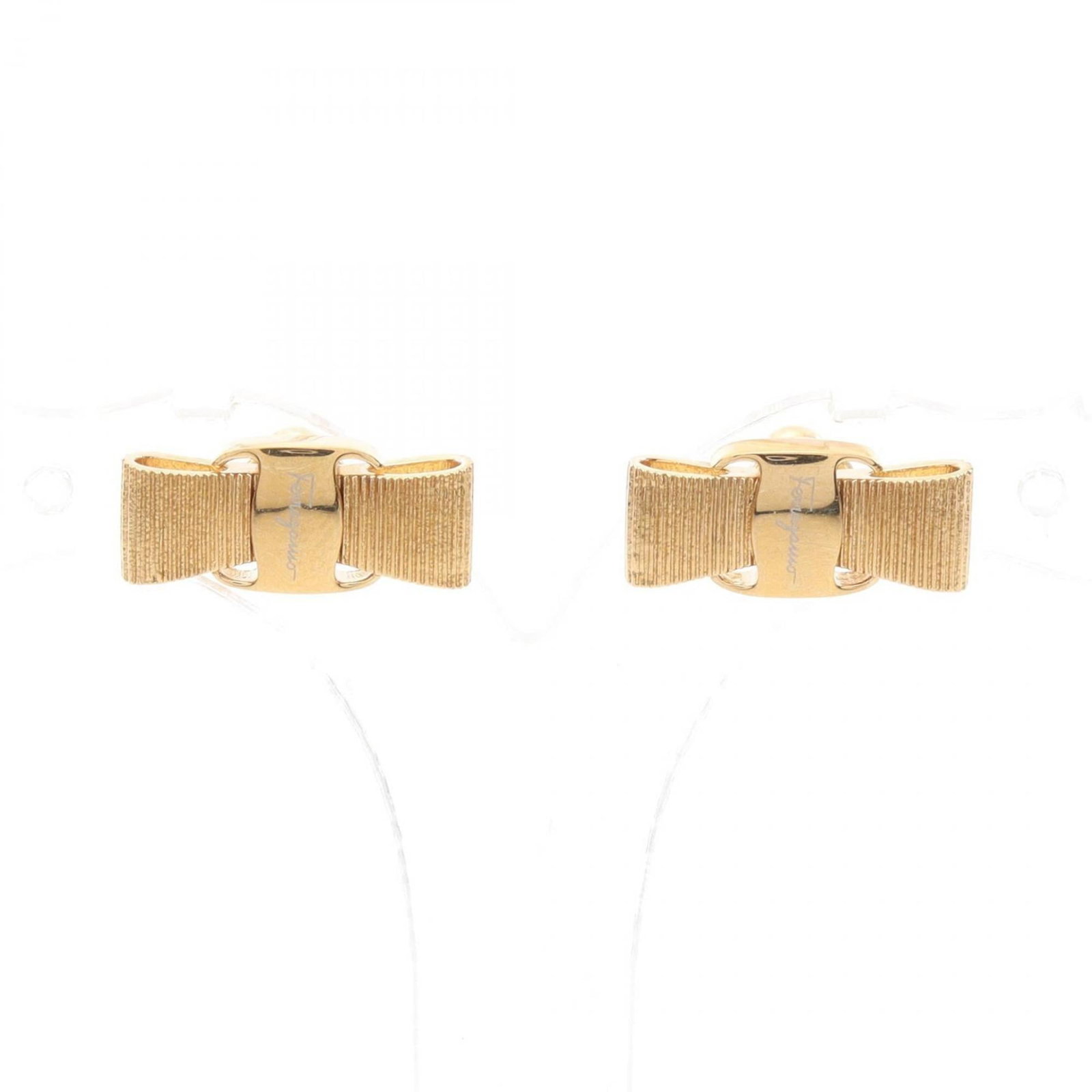 SALVATORE FERRAGAMO Stud Earrings Gold Plating: SALVATORE FERRAGAMO Stud Earrings Gold Plating Stud earrings in gold plating, featuring the Salvatore Ferragamo brand, with a signature. The earrings have visible scratches, scuffs, and dirt, but are