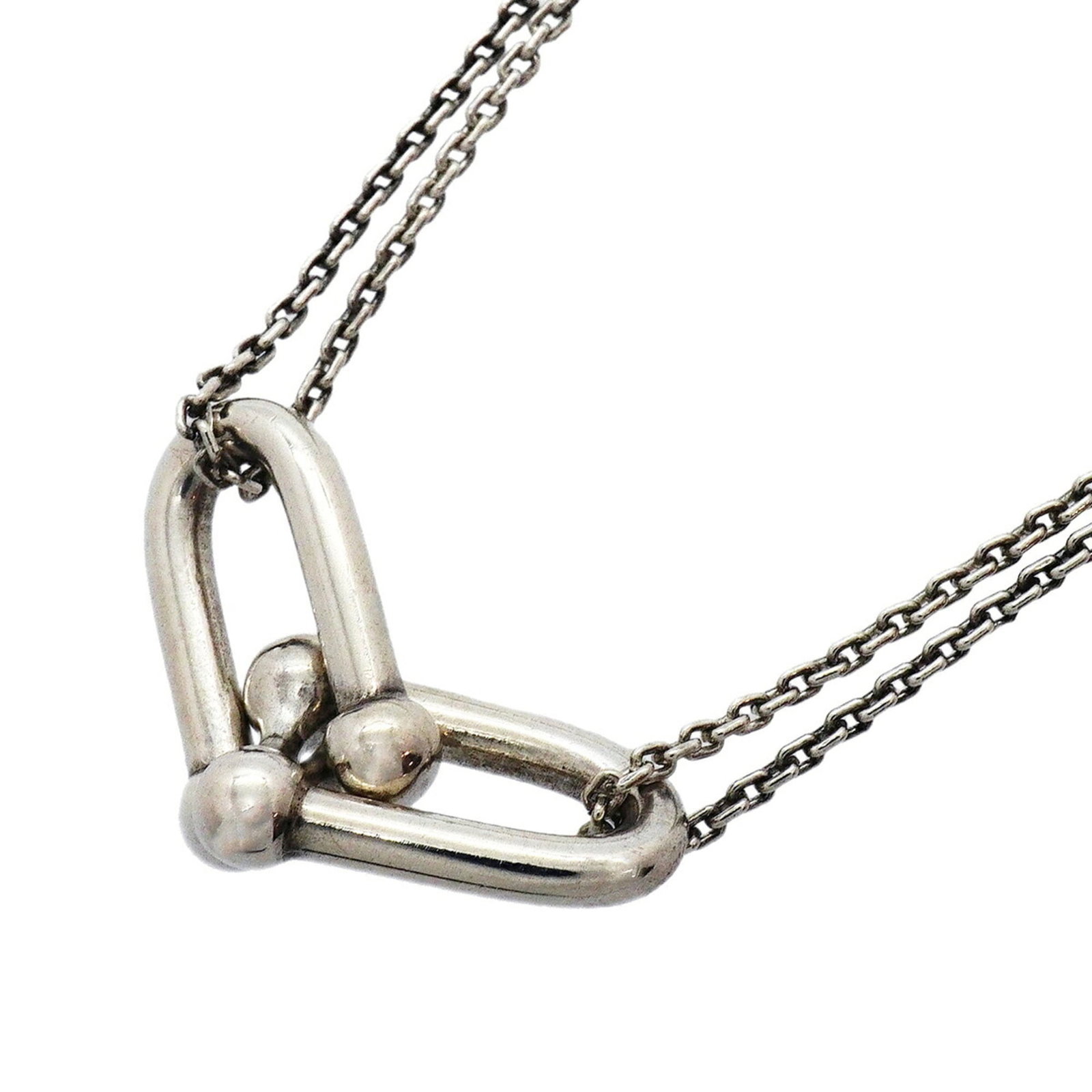 TIFFANY Silver 925: TIFFANY Silver 925 Silver 925 Tiffany Necklace with Visible Wear. This 41cm necklace features a 11.4mm x 30.6mm pendant made from sterling silver, bearing a signature. The necklace is in good used con