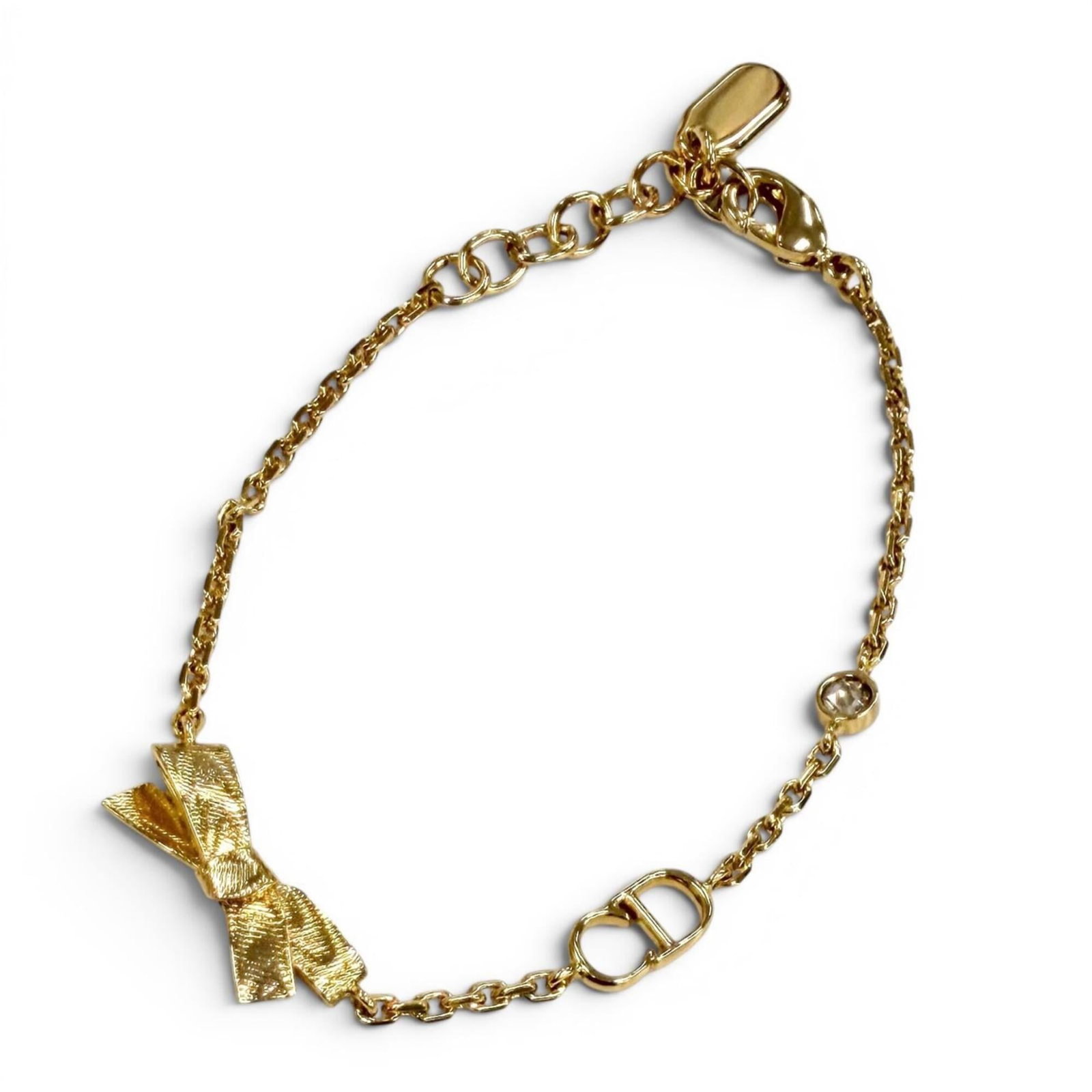 CHRISTIAN DIOR Charm Bracelet Gold: CHRISTIAN DIOR Charm Bracelet Gold Gold Charm Bracelet from Christian Dior, featuring a 15cm-18cm length and a like new condition with only the faintest traces of wear. This charm bracelet boasts a lu