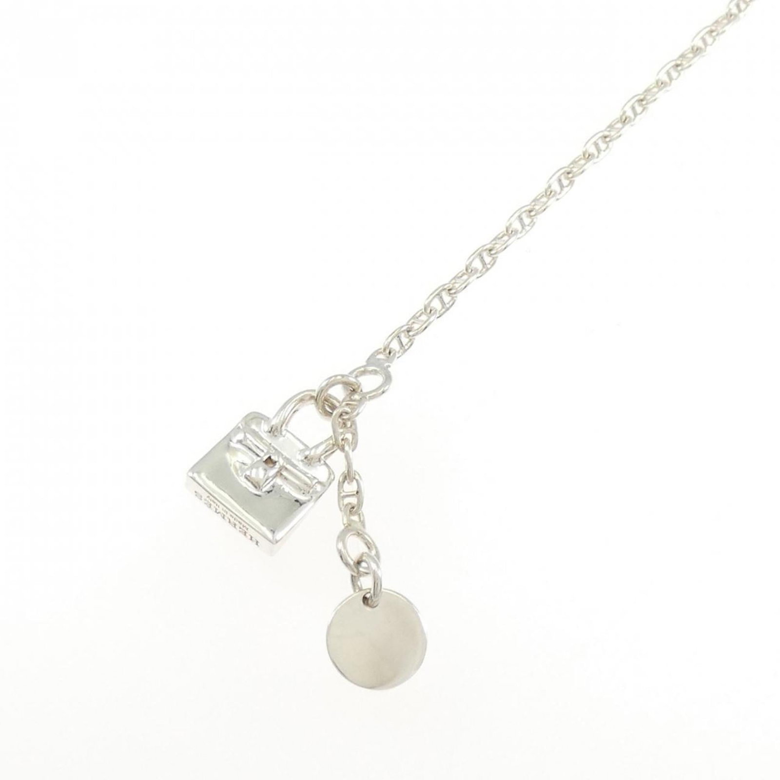 HERMES Charm Bracelet Silver 925: HERMES Charm Bracelet Silver 925 Silver 925 Charm Bracelet from Hermes, designed with a sleek and modern aesthetic, featuring a silver 925 chain with a length of 15cm-16.5cm. This charm bracelet is in