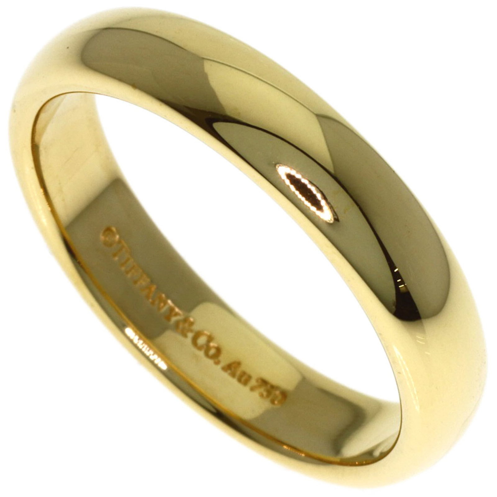 TIFFANY Band Ring Yellow Gold (18K): TIFFANY Band Ring Yellow Gold (18K) Yellow gold band ring from Tiffany Type, featuring a classic design in 18K gold. The ring shows minor signs of wear, with small scratches or light marks, but remain