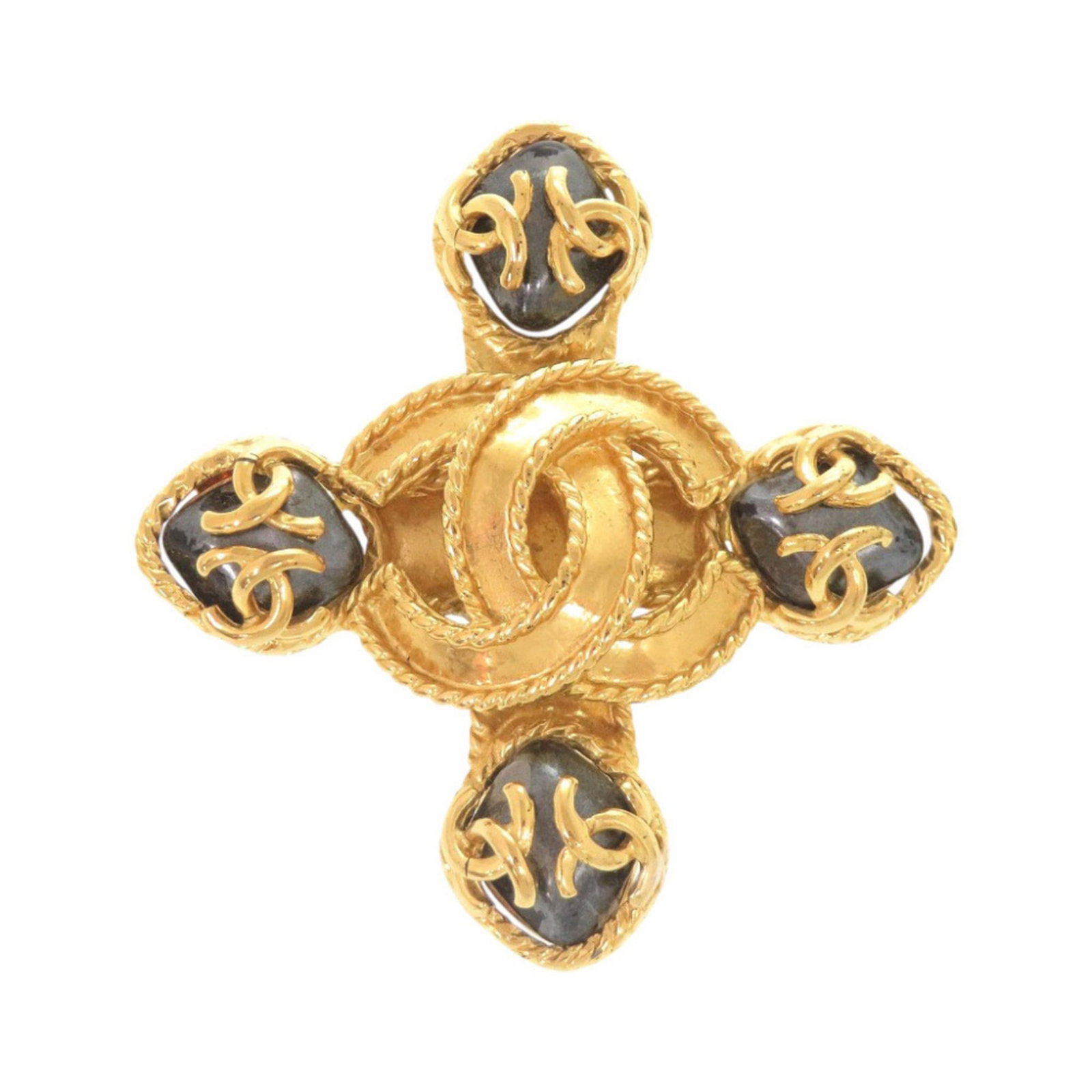 CHANEL Brooch Metal: CHANEL Brooch Metal Gold Chanel Brooch, bearing a signature, is a metal piece from the French fashion house. It features a classic design with visible scratches and scuffs, indicating its used conditi