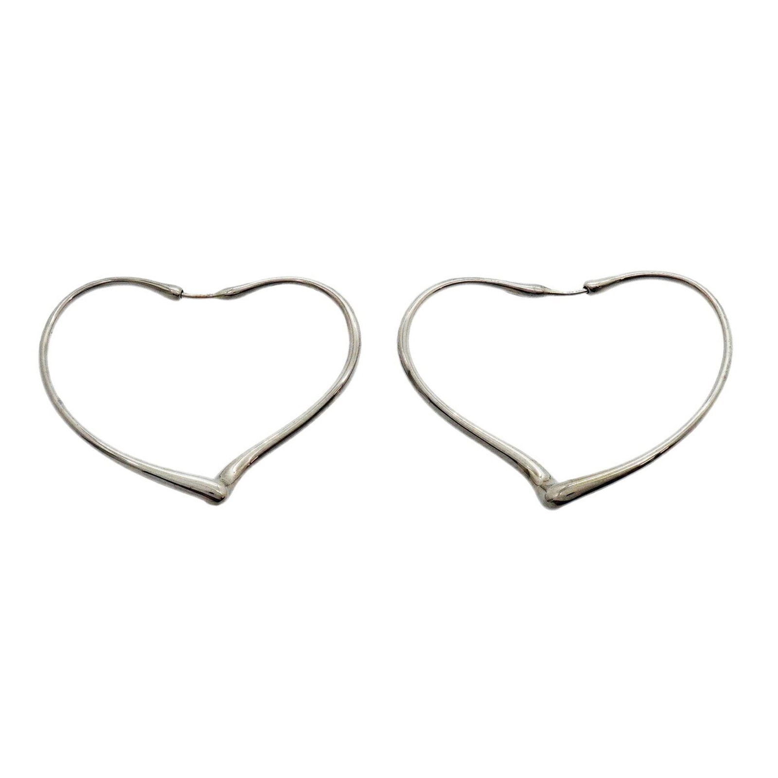 TIFFANY Stud Earrings Silver 925: TIFFANY Stud Earrings Silver 925 Silver 925 stud earrings from Tiffany, featuring a classic design with a subtle sheen. The earrings bear visible signs of wear, including scratches and scuffs, but rem