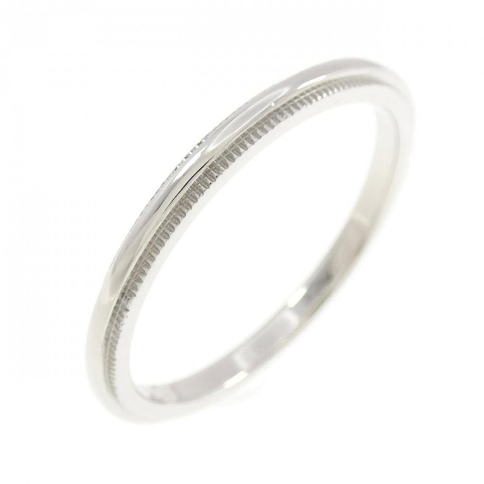 TIFFANY Band Ring Platinum 950: TIFFANY Band Ring Platinum 950 Platinum 950 construction provides a durable foundation for this Tiffany band ring, while its 950 platinum material gives it a luxurious feel. The ring's band design is 