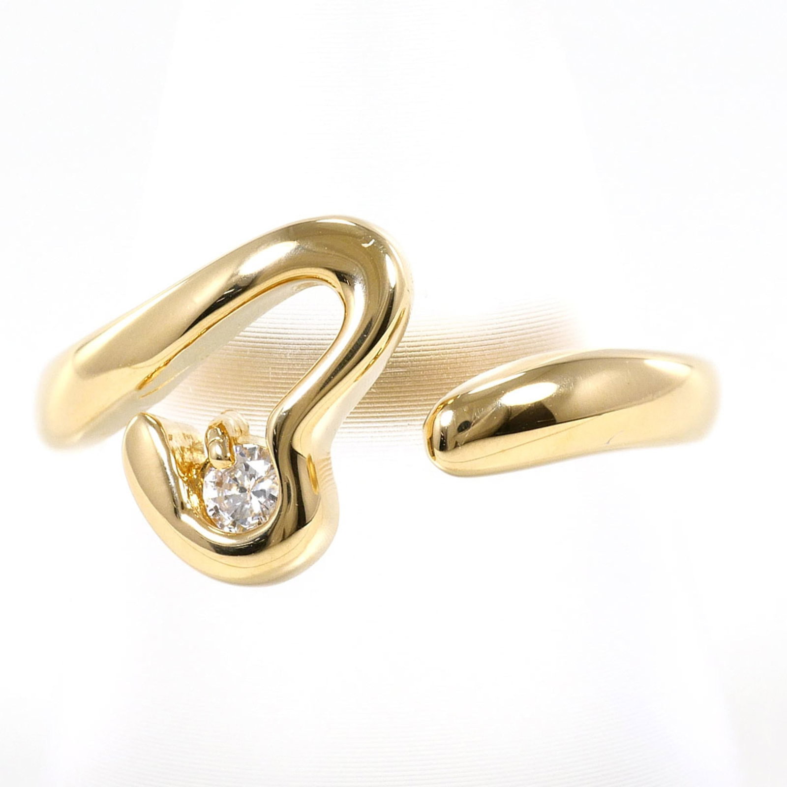 Band Ring Yellow Gold (18K): Band Ring Yellow Gold (18K) Yellow gold 18K band ring features a 0.07ct diamond, measuring 11mm in width. Made from 18K yellow gold, this ring weighs 3.8g and is available in a US size 7. In