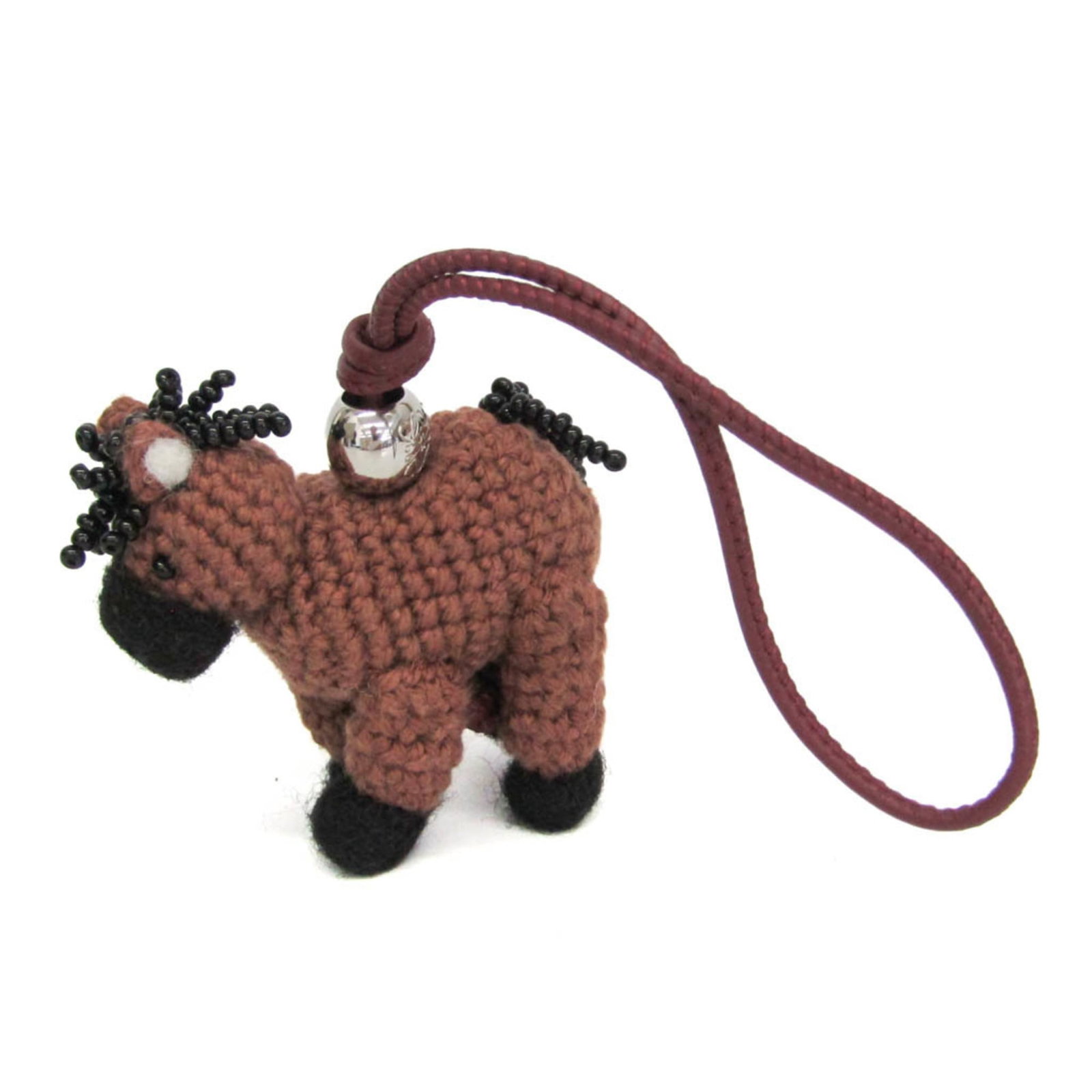 LOEWE Handbag Charm Leather: LOEWE Handbag Charm Leather The LOEWE Horse Charm 2026 New Year Capsule Collection is a sleek and sophisticated handbag charm made from high-quality leather and adorned with a striking silver metal