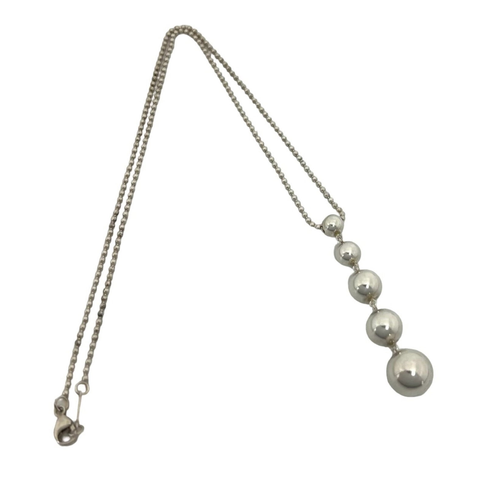 TIFFANY Silver 925: TIFFANY Silver 925 Silver Tiffany Necklace in Good Used Condition. This 925 sterling silver necklace features a 48mm x 9mm pendant and has a 41.1 cm / 16.18'' adjustable neck circumference. The neckla