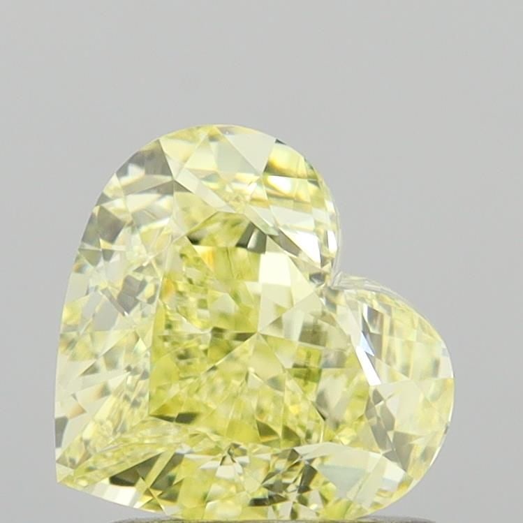 GIA Heart 1.52ct Fancy Yellow VVS1 - Loose Natural Diamond: GIA Heart 1.52ct Fancy Yellow VVS1 - Loose Natural Diamond GIA-certified, this 1.52ct Fancy Yellow VVS1 diamond boasts exceptional clarity and a vibrant, sunny hue. Measuring 6.58L x 7.27W x 4.29H,