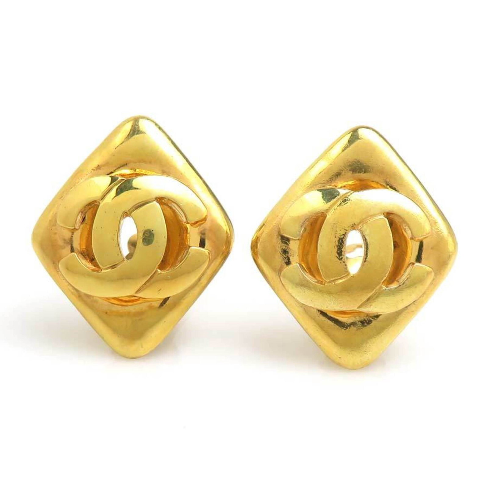 CHANEL Clip Earrings Metal: CHANEL Clip Earrings Metal Gold Clip Earrings from Chanel, France. Made from metal, these clip earrings feature a classic design with visible wear, including scratches and scuffs. In good condition,