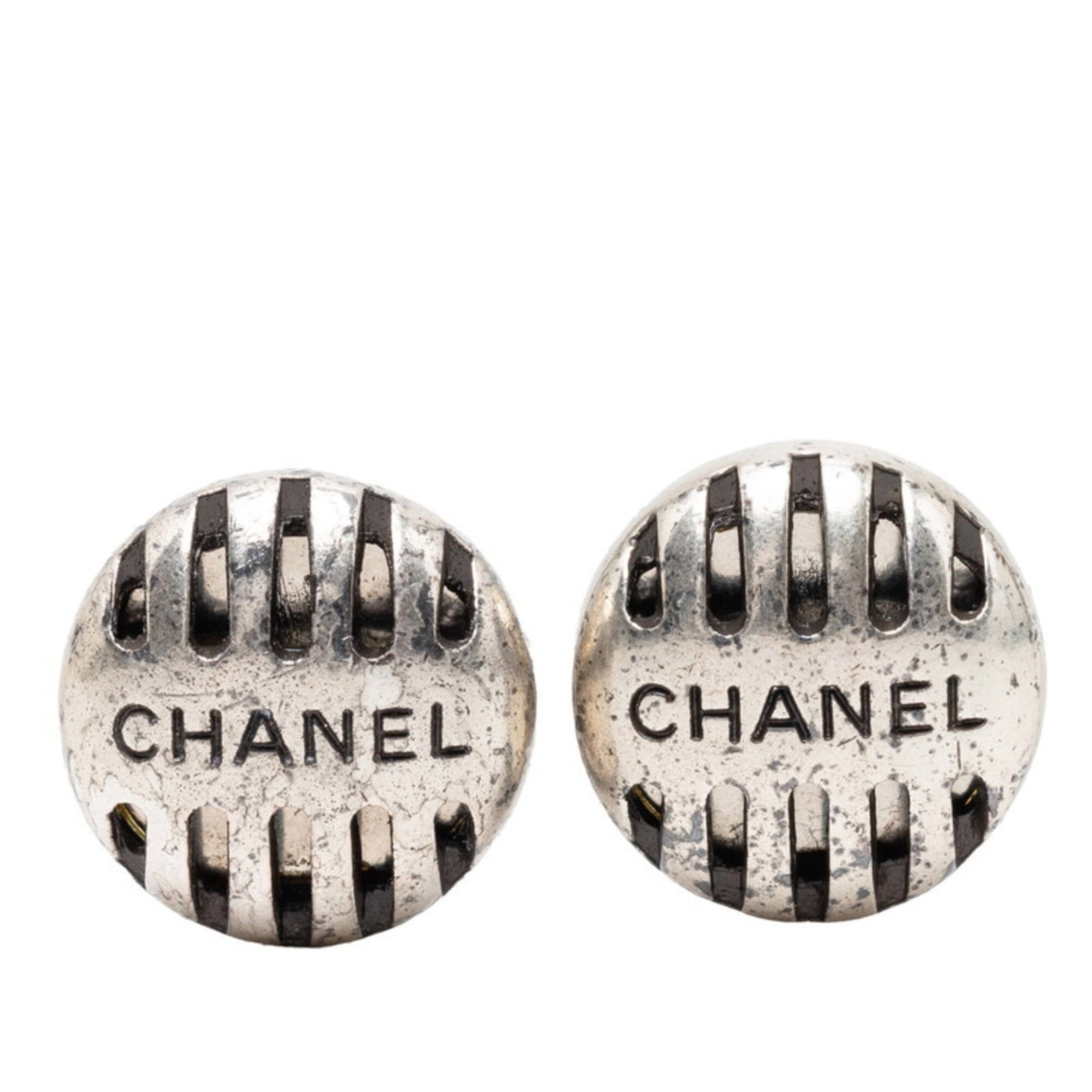 CHANEL Clip Earrings Metal: CHANEL Clip Earrings Metal Chanel Clip Earrings Metal - A Timeless AccessorySilver clip earrings with a sleek, modern design, bearing the iconic Chanel brand. The earrings feature a subtle metal finis