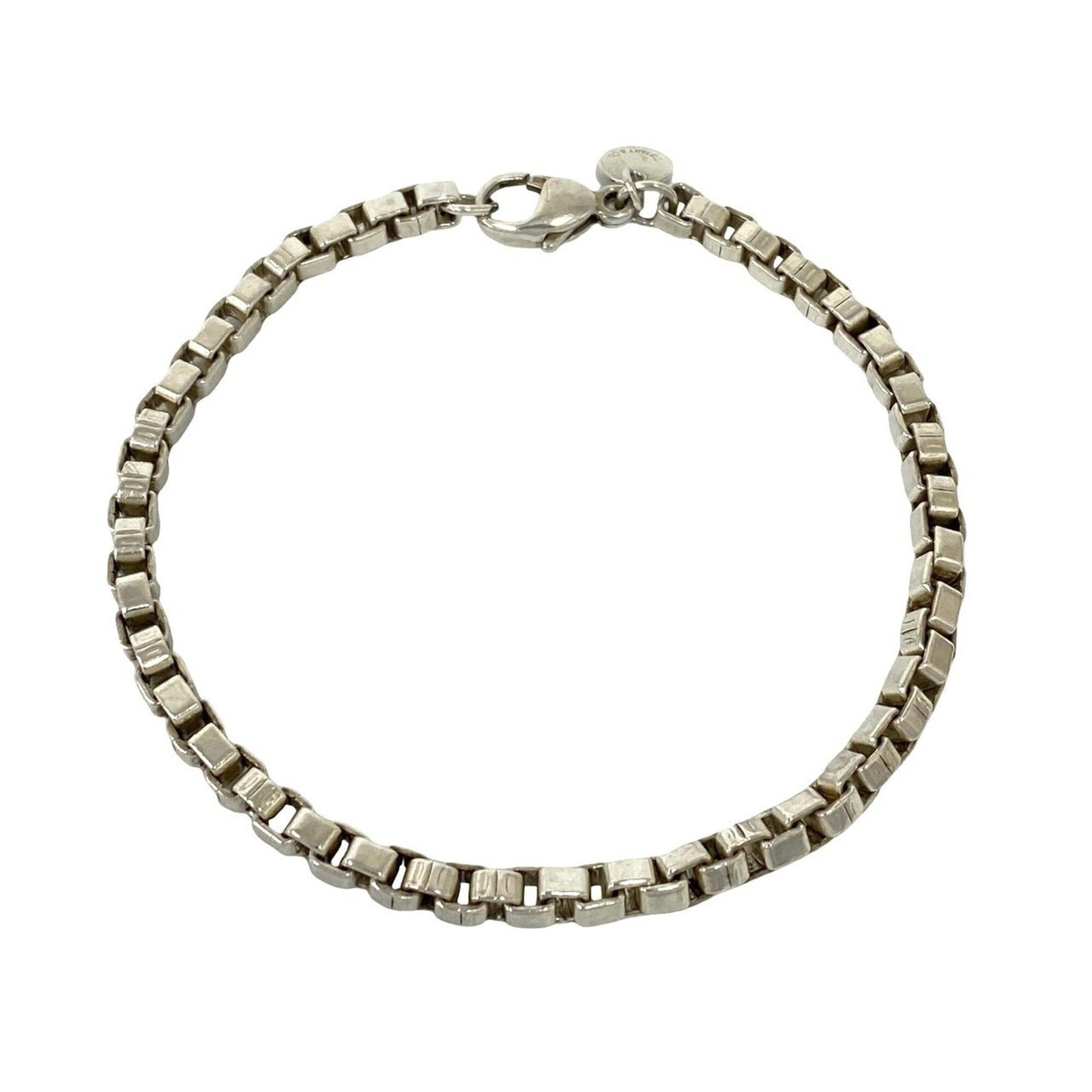 TIFFANY Charm Bracelet Silver 925: TIFFANY Charm Bracelet Silver 925 Silver 925 Tiffany Charm Bracelet with visible wear, scratches, and scuffs. This 18.5cm charm bracelet is made from high-quality silver and bears a signature. It is i