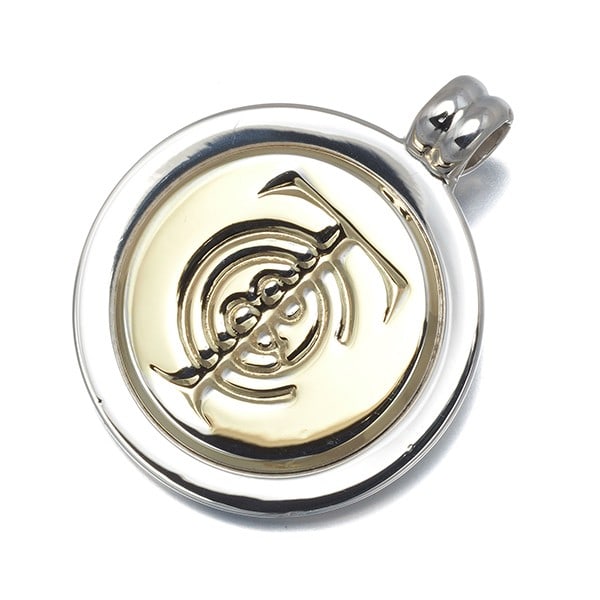 Tiffany&Co. Pendant Symbol Coin 925 Sterling Silver/18K 750 Yellow Gold: Tiffany&Co. Pendant Symbol Coin 925 Sterling Silver/18K 750 Yellow Gold Sterling Silver and 18K Yellow Gold Pendant Symbol Coin from Tiffany & Co. - A sleek and sophisticated design featuring a 925