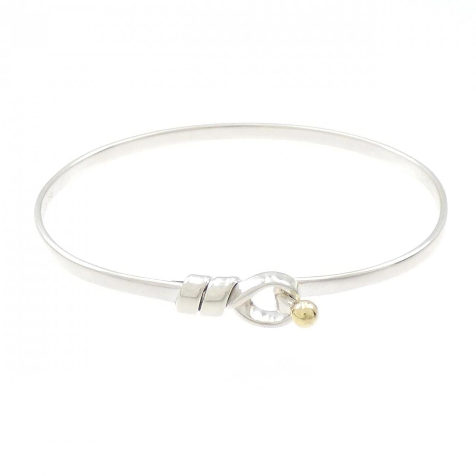 TIFFANY Bangle Silver 925 Yellow Gold (18K): TIFFANY Bangle Silver 925 Yellow Gold (18K) Silver 925 and 18K yellow gold combine in this elegant bangle from Tiffany, a timeless piece that adds a touch of sophistication to any outfit. The 17.5cm l