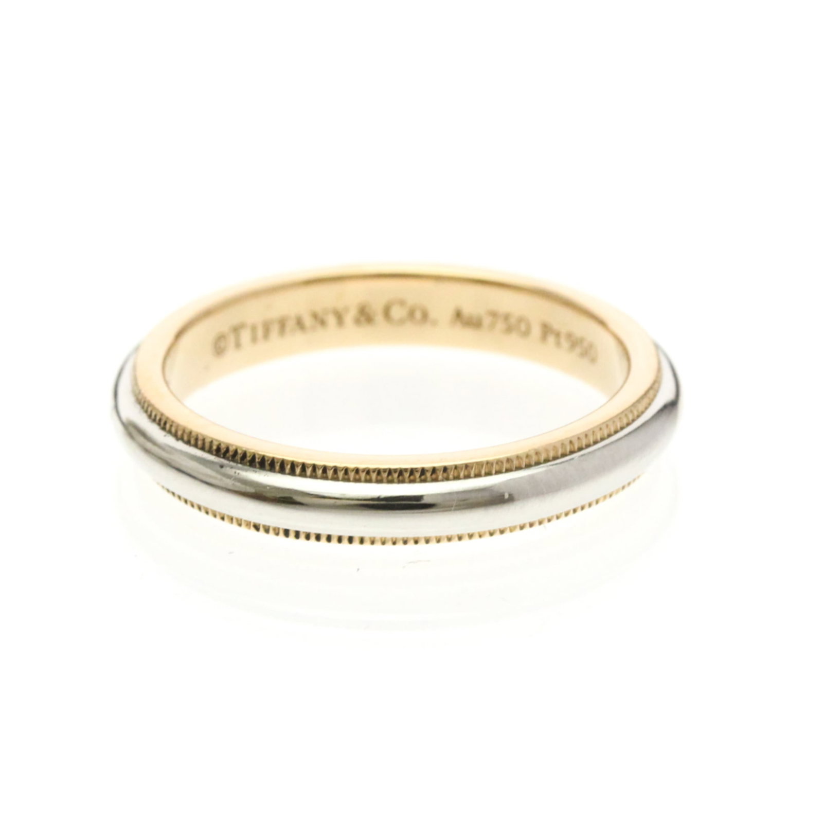 TIFFANY Band Ring Pink Gold (18K): TIFFANY Band Ring Pink Gold (18K) Pink gold 18K band ring with intricate milgrain details, adding a touch of elegance to any outfit. This gently used ring features a slender 3.5mm width and weighs 6.3