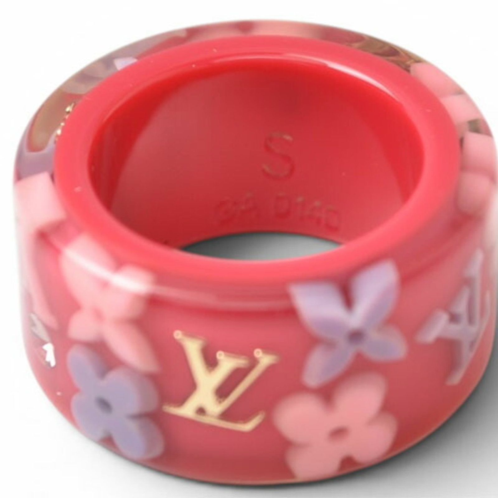 LOUIS VUITTON Band Ring Plastic: LOUIS VUITTON Band Ring Plastic Pink Louis Vuitton band ring made from plastic, available in US size 5.5, with a very good condition featuring minor signs of wear. The ring bears a signature, and its 