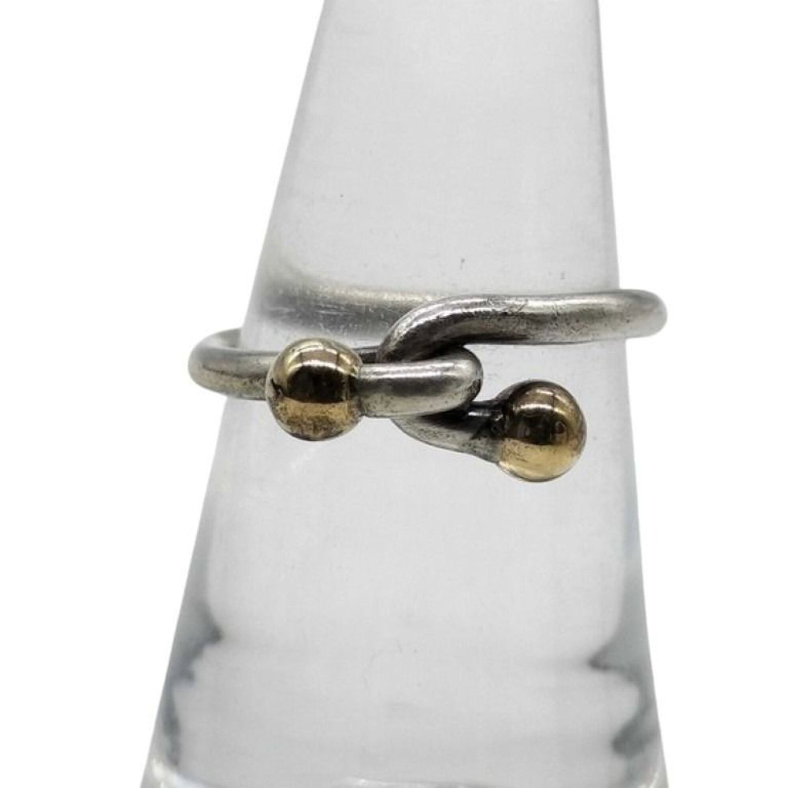 TIFFANY Band Ring Silver 925: TIFFANY Band Ring Silver 925 Silver 925 band ring from Tiffany, featuring a classic design in gold and silver. The item is a women's band ring with visible wear, scratches, and scuffs, but remains ful