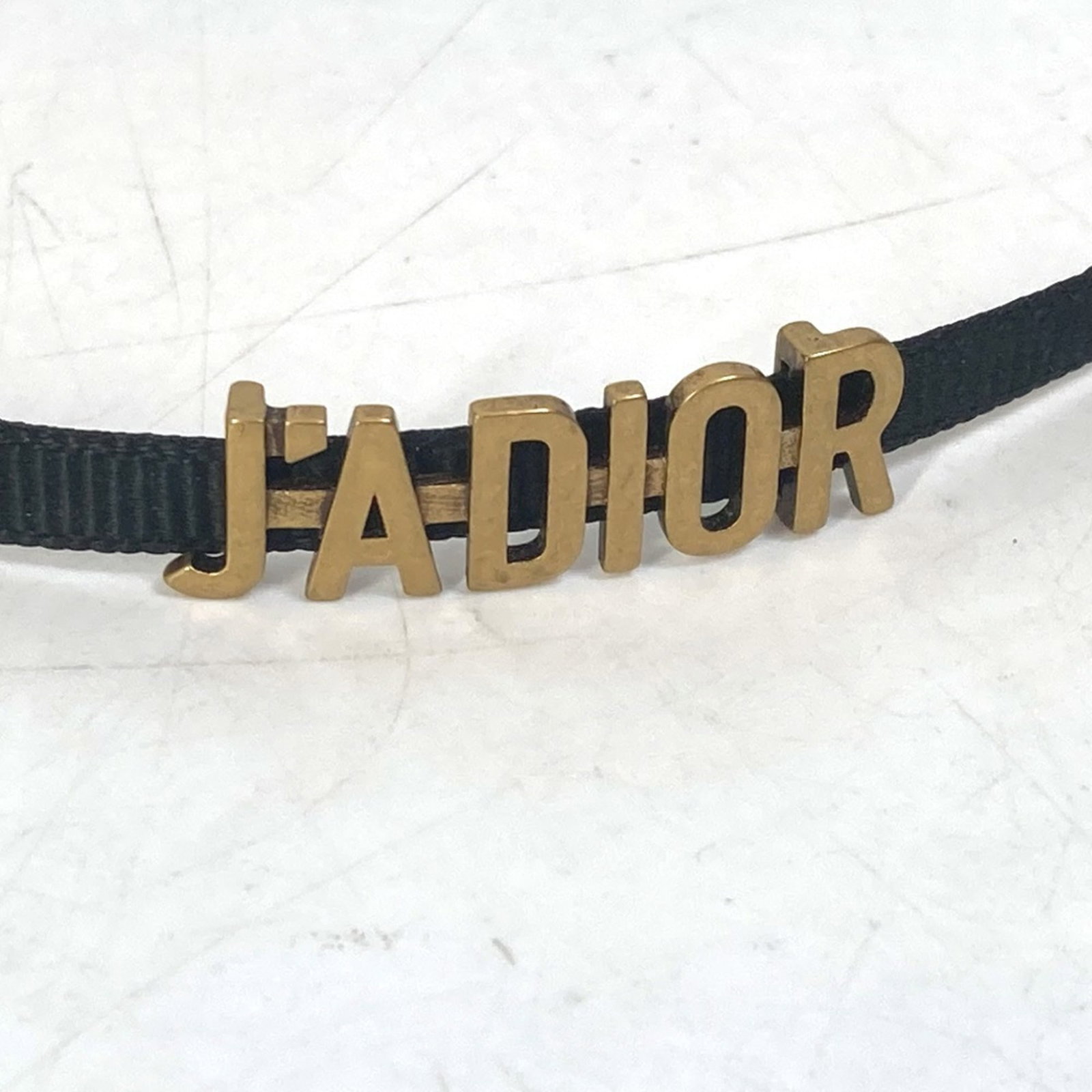CHRISTIAN DIOR Necklace Other: CHRISTIAN DIOR Necklace Other Gently used gold Christian Dior necklace with a total length of 14.4 inches, bearing minor signs of wear. The necklace is in very good condition, with small scratches or 
