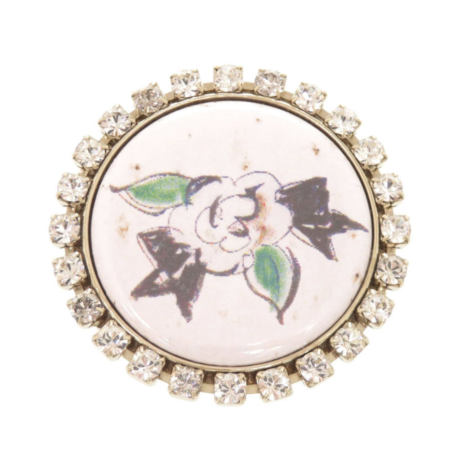 CHANEL Brooch Metal Rhinestone: CHANEL Brooch Metal Rhinestone Metal Rhinestone Brooch from Chanel, Italy, featuring a striking white metal and rhinestone design. Measuring 4.7cm x 4.7cm, this gently used brooch showcases minor sign
