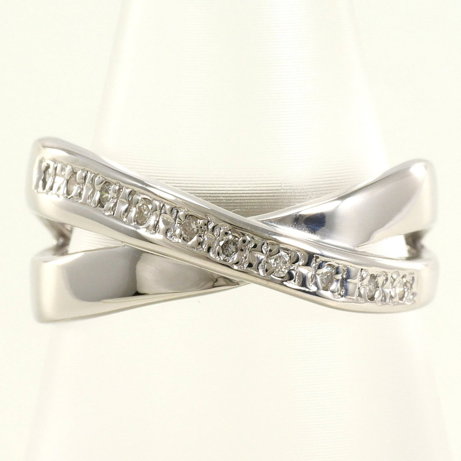 Band Ring White Gold (10K): Band Ring White Gold (10K) White gold band ring with a 0.06ct diamond, offering a subtle touch of elegance to any outfit. Made from 10K white gold, this ring boasts a sleek 9mm width and US size 6.5 f