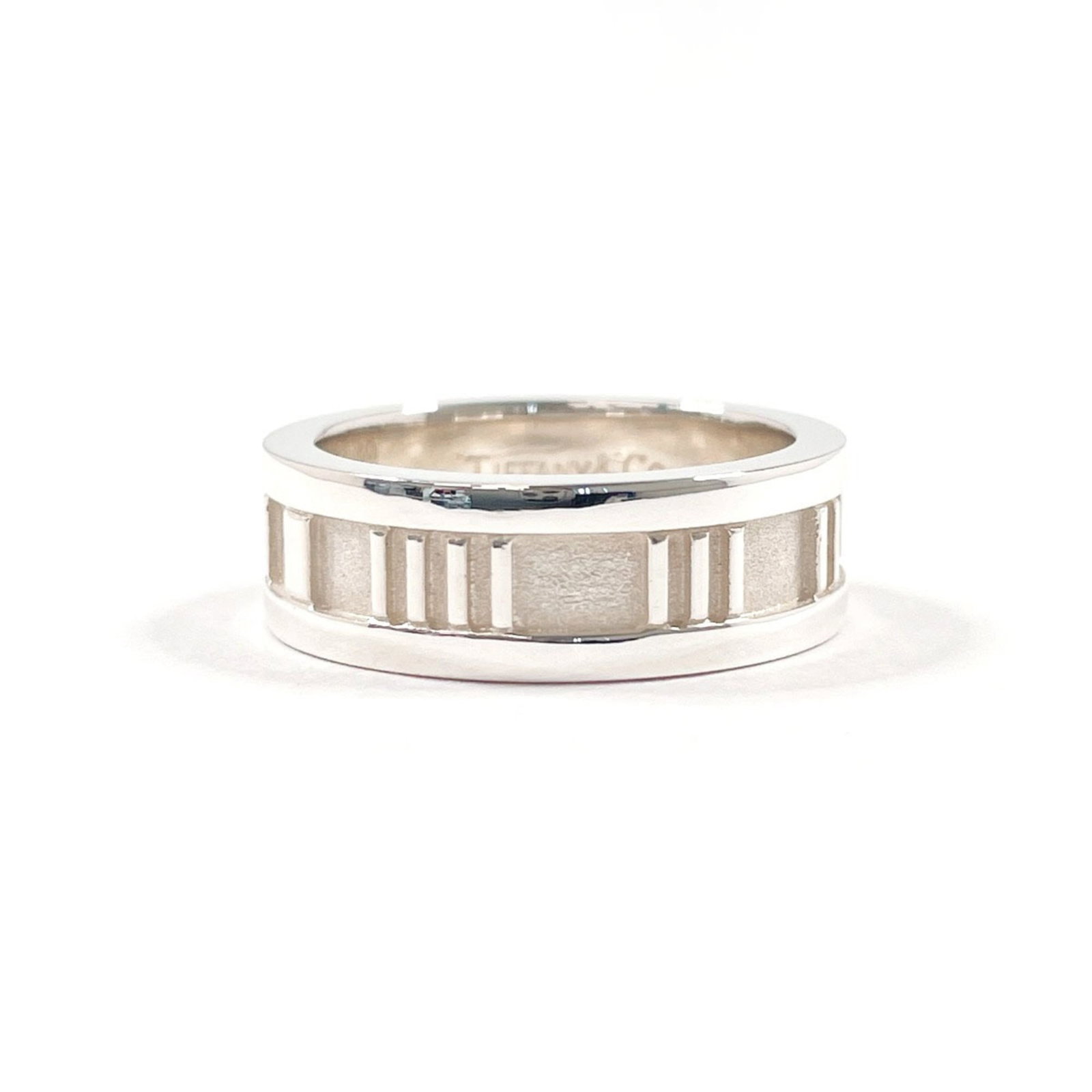 TIFFANY Band Ring Silver 925: TIFFANY Band Ring Silver 925 Silver 925 band ring from the Tiffany Atlas line, featuring a 4.5 US size and 6.2mm width, adds a touch of elegance to any outfit. Gently used with minor signs of wear, th