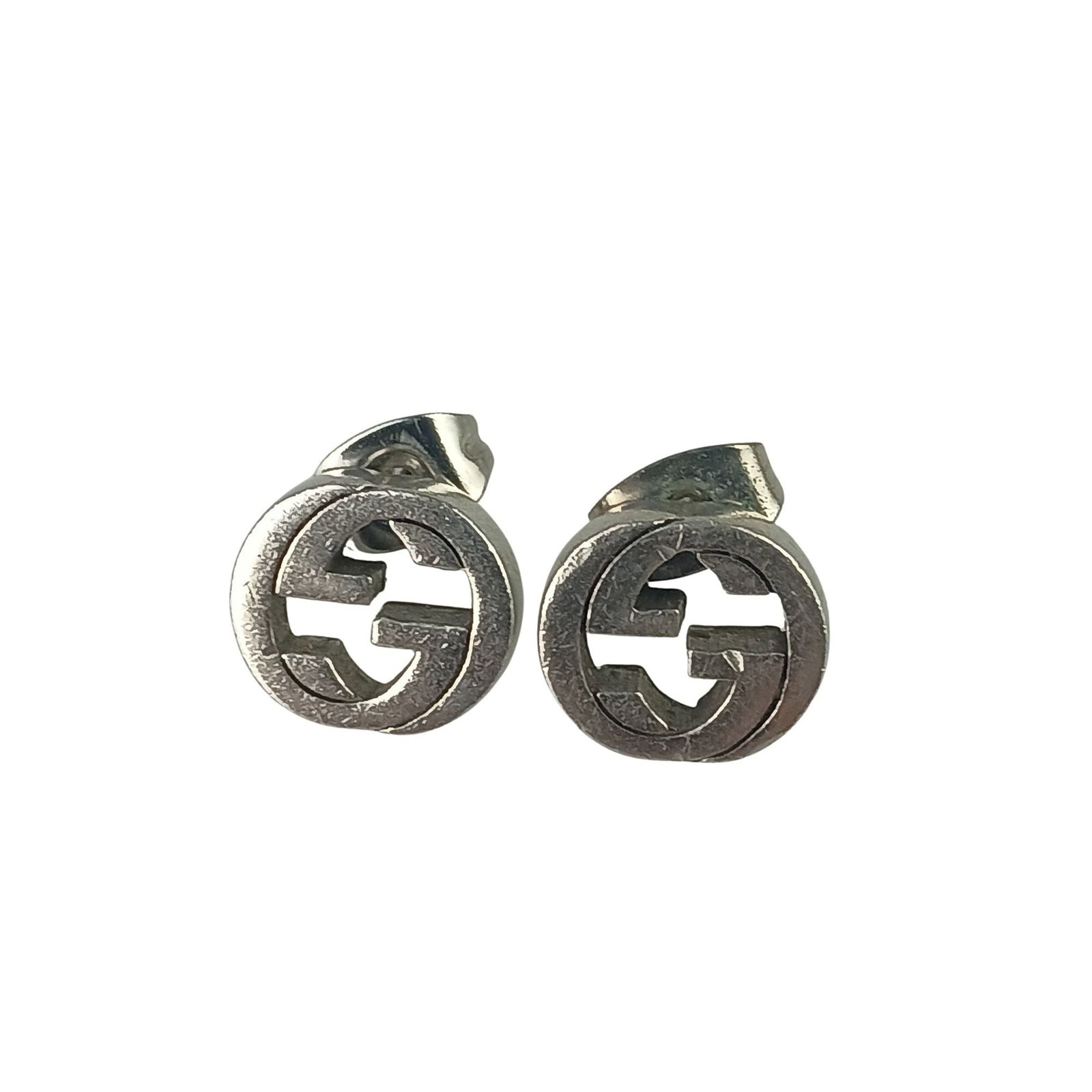 GUCCI Stud Earrings Silver 925: GUCCI Stud Earrings Silver 925 Silver 925 stud earrings from Gucci, featuring a sleek and modern design. Made from high-quality silver, these earrings showcase a subtle shine and a touch of Italian el