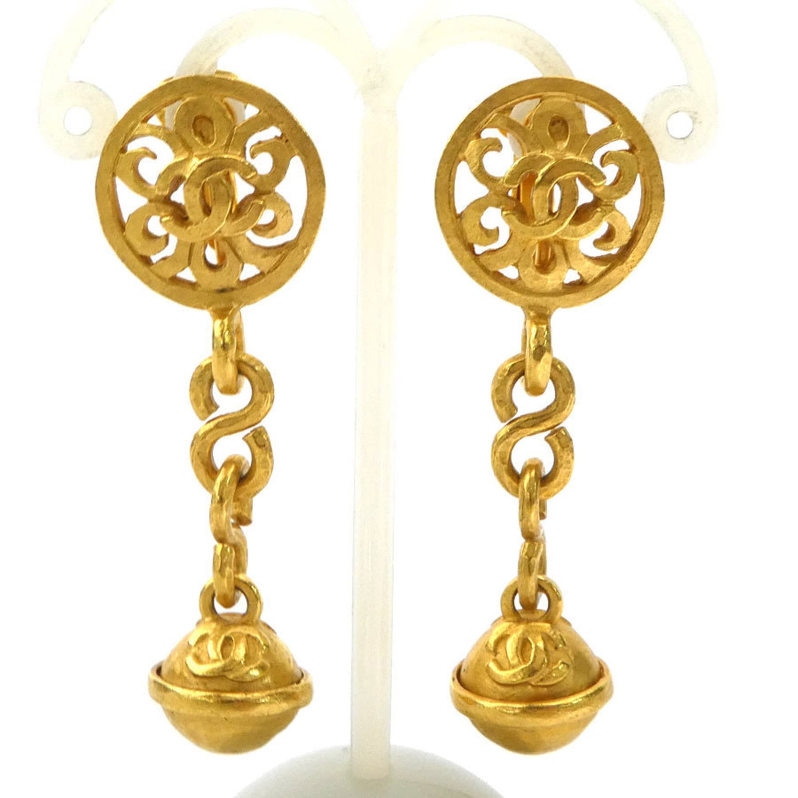 CHANEL Clip Earrings Metal: CHANEL Clip Earrings Metal Gold Clip Earrings from CHANEL, featuring a metal design with visible scratches and scuffs. Made in France, these clip earrings are a classic accessory for women. Item