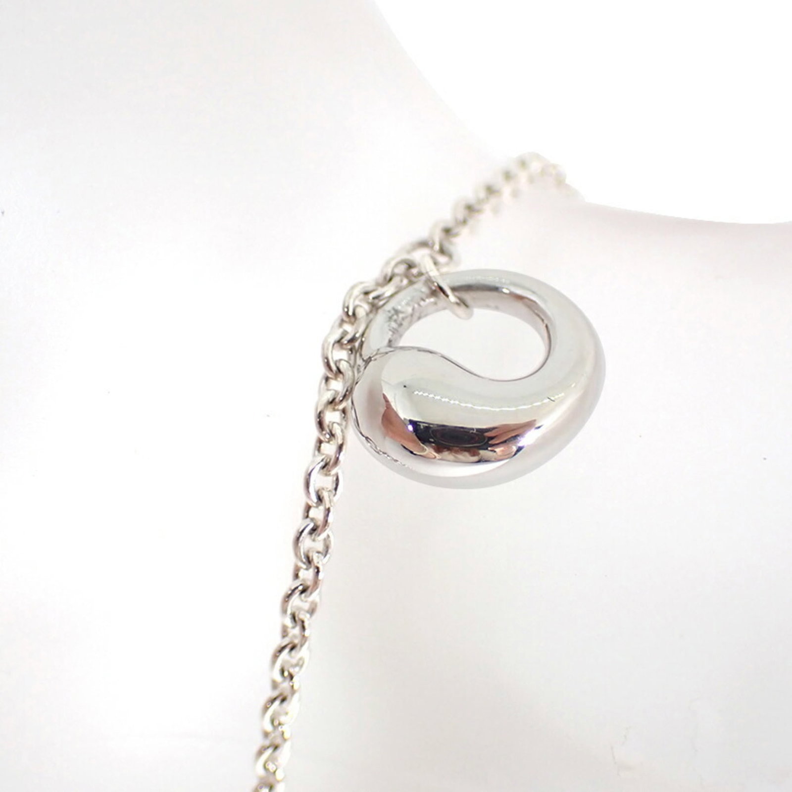 TIFFANY Charm Bracelet Sterling Silver 925: TIFFANY Charm Bracelet Sterling Silver 925 Sterling silver 925 Tiffany charm bracelet in excellent condition, measuring 19cm in length. This like new used bracelet boasts a delicate charm design, show