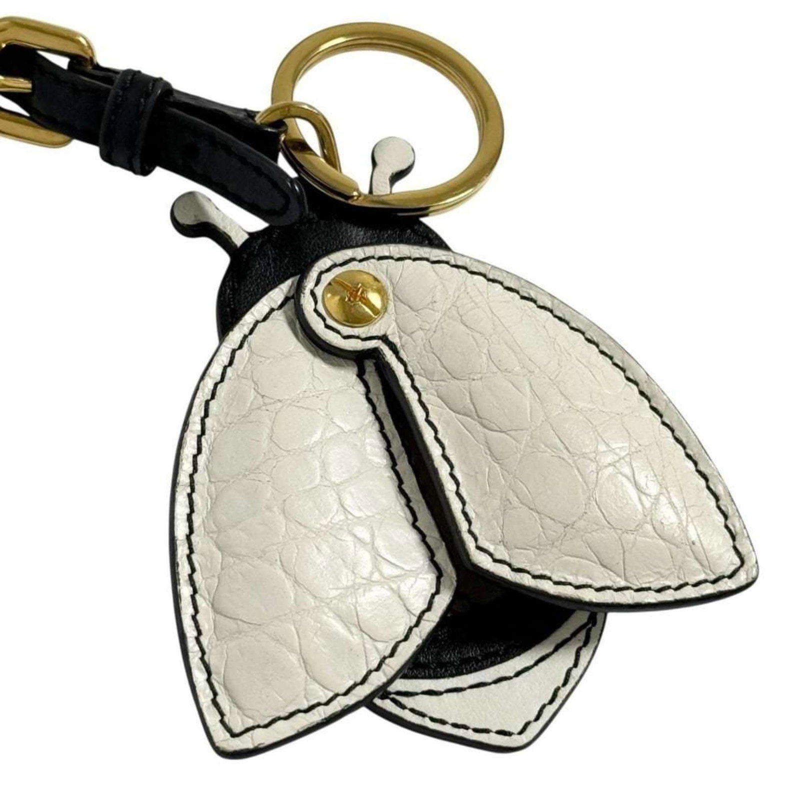 PRADA Handbag Charm Leather Metal: PRADA Handbag Charm Leather Metal Leather and metal come together in this Prada handbag charm, a stylish accessory that adds a touch of elegance to any outfit. The charm features a small, intricate