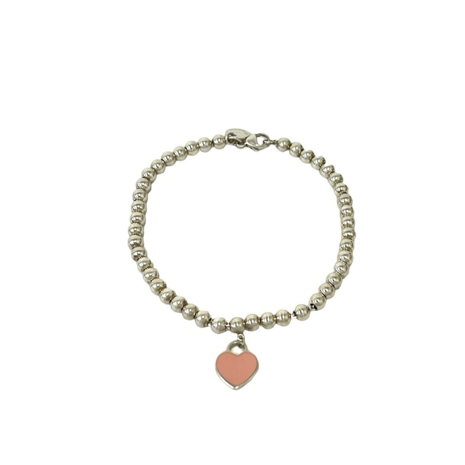 TIFFANY Charm Bracelet Silver 925: TIFFANY Charm Bracelet Silver 925 Silver 925 Tiffany charm bracelet with a pink accent, measuring 17.5cm in length, features a mix of scratches, scuffs, and dirt, but remains fully functional. This pr