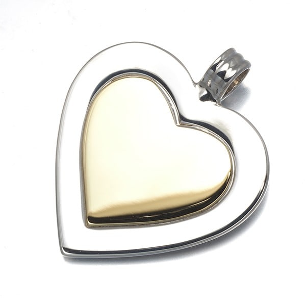 Tiffany&Co. Pendant Heart Bicolor 18K Yg/Silver 925: Tiffany&Co. Pendant Heart Bicolor 18K Yg/Silver 925 Tiffany&Co.'s Pendant Heart Bicolor in 18k Yellow Gold is a striking design that showcases the brand's signature style. This elegant pendant