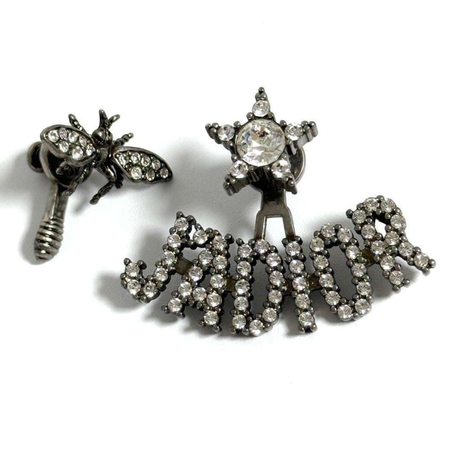 CHRISTIAN DIOR Stud Earrings Metal Rhinestone: CHRISTIAN DIOR Stud Earrings Metal Rhinestone Metal and rhinestone stud earrings from Christian Dior, featuring a subtle touch of luxury. The earrings are in like new condition, with only the faintest
