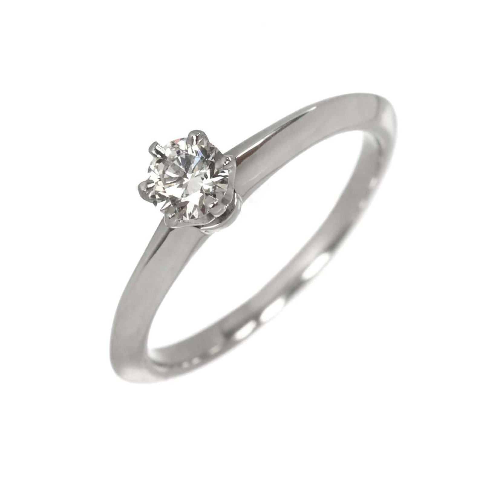 TIFFANY Band Ring: TIFFANY Band Ring Platinum band ring from Tiffany, featuring a 0.25 carat diamond, available in a US size 4.5. This like new used ring boasts excellent condition with only the faintest traces of wear,