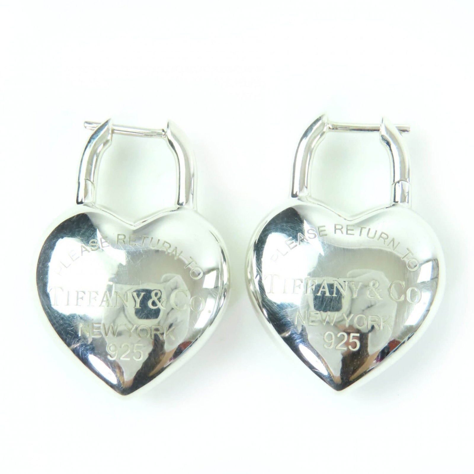 TIFFANY Stud Earrings Silver 925: TIFFANY Stud Earrings Silver 925 Stud earrings featuring the iconic Tiffany design, crafted from sterling silver 925. With a subtle 3.00mm x 2.00mm profile, these elegant earrings add a touch of sophi