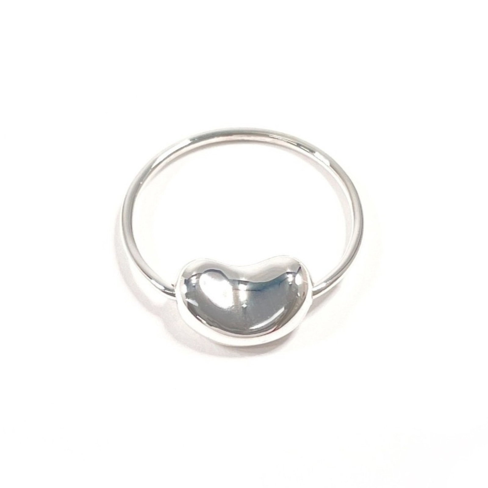 TIFFANY Band Ring Silver 925: TIFFANY Band Ring Silver 925 Silver 925 band ring from Tiffany's Bean collection, featuring a sleek and sophisticated design. This gently used piece has minor signs of wear, with small scratches or