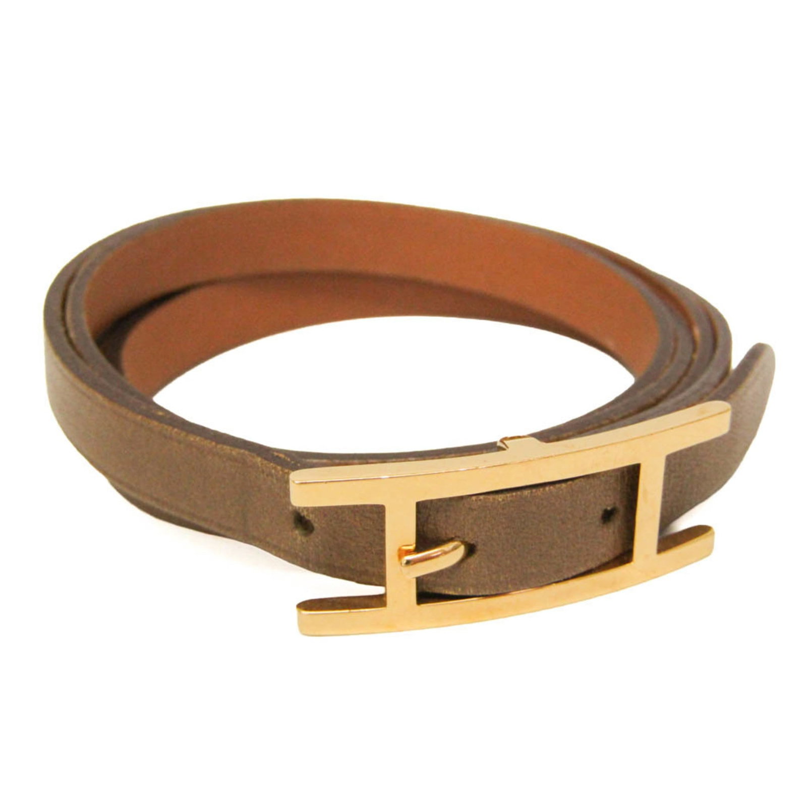 HERMES Bangle Leather Metal: HERMES Bangle Leather Metal Leather and gold bangle from the Hermes Hapi line, featuring a classic fashion design with a subtle beige color. Made from high-quality leather and metal, this bangle