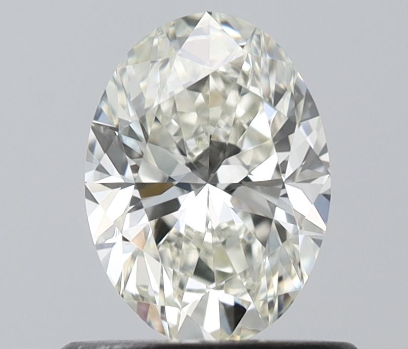 IGI Oval 0.6ct J VVS1 - Loose Natural Diamond: IGI Oval 0.6ct J VVS1 - Loose Natural Diamond 0.6ct IGI Oval J VVS1 Diamond - Natural BeautyThe IGI Oval 0.6ct J VVS1 diamond boasts exceptional clarity and color, with a VVS1 grade indicating