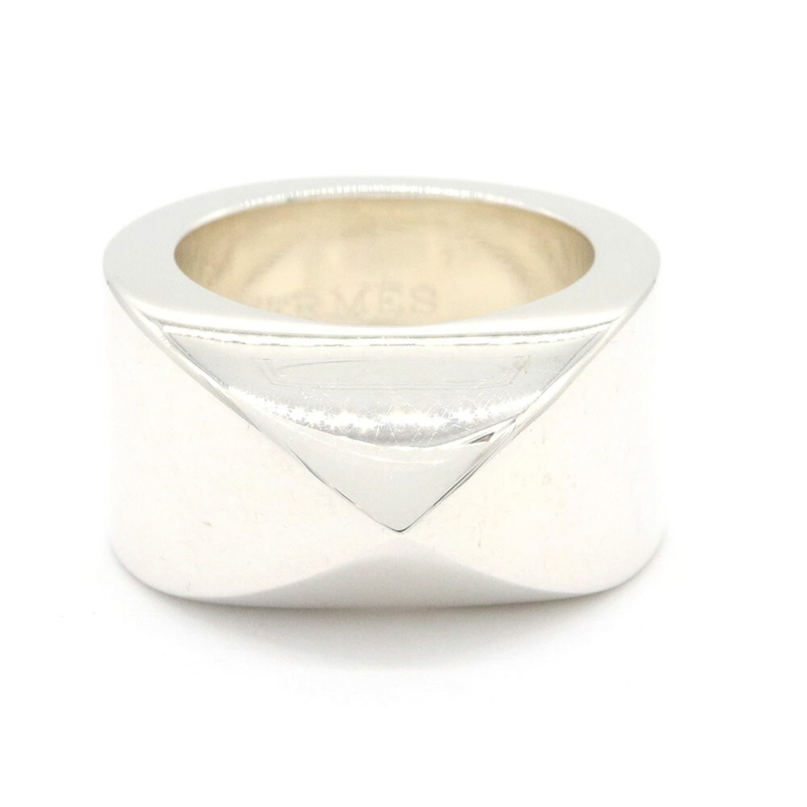 HERMES Band Ring Sterling Silver 925: HERMES Band Ring Sterling Silver 925 Sterling silver 925 band ring from the Hermes Medor line, crafted in Japan. This gently used ring features minor scratches and light marks, yet remains in very