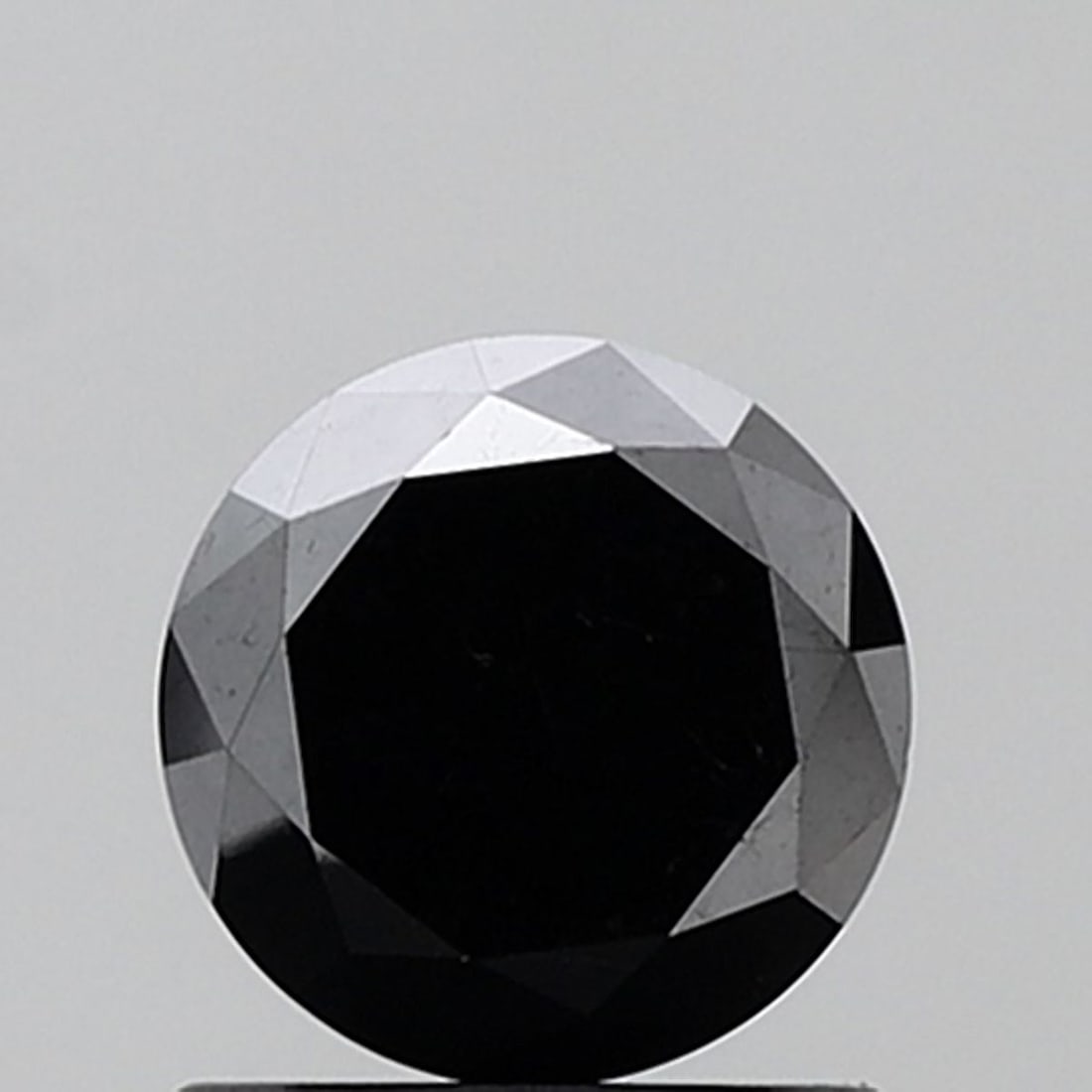 Round 1.22ct Black VVS2 - Loose Natural Diamond: Round 1.22ct Black VVS2 - Loose Natural Diamond 1.22ct Black VVS2 - Loose Natural DiamondThis exquisite black diamond boasts exceptional clarity, with a VVS2 grade indicating minimal inclusions. Its