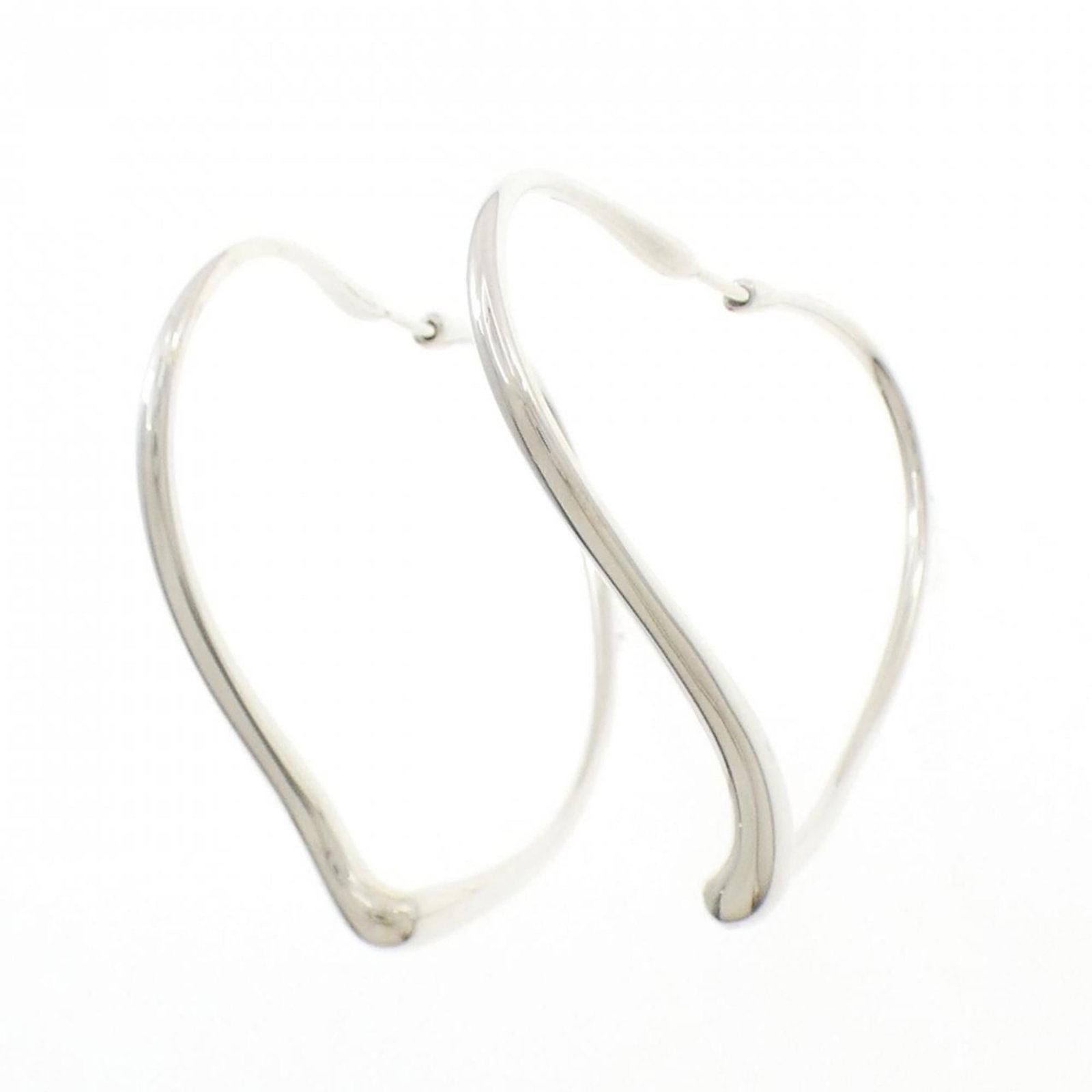 TIFFANY Hoop Earrings: TIFFANY Hoop Earrings Silver Tiffany hoop earrings with a subtle Open Heart design, featuring a delicate 40mm diameter and 4.9mm width. Gently used with minor signs of wear, these earrings showcase a