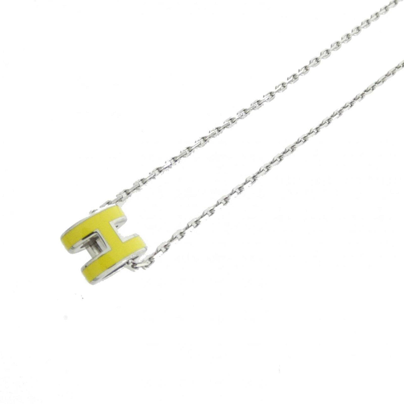 HERMES Lime Necklace: HERMES Lime Necklace The Hermes Lime Necklace is a vibrant and stylish accessory, featuring a 9mm x 7mm lime-colored pendant. Gently used, this necklace boasts a 40 cm circumference and comes with a