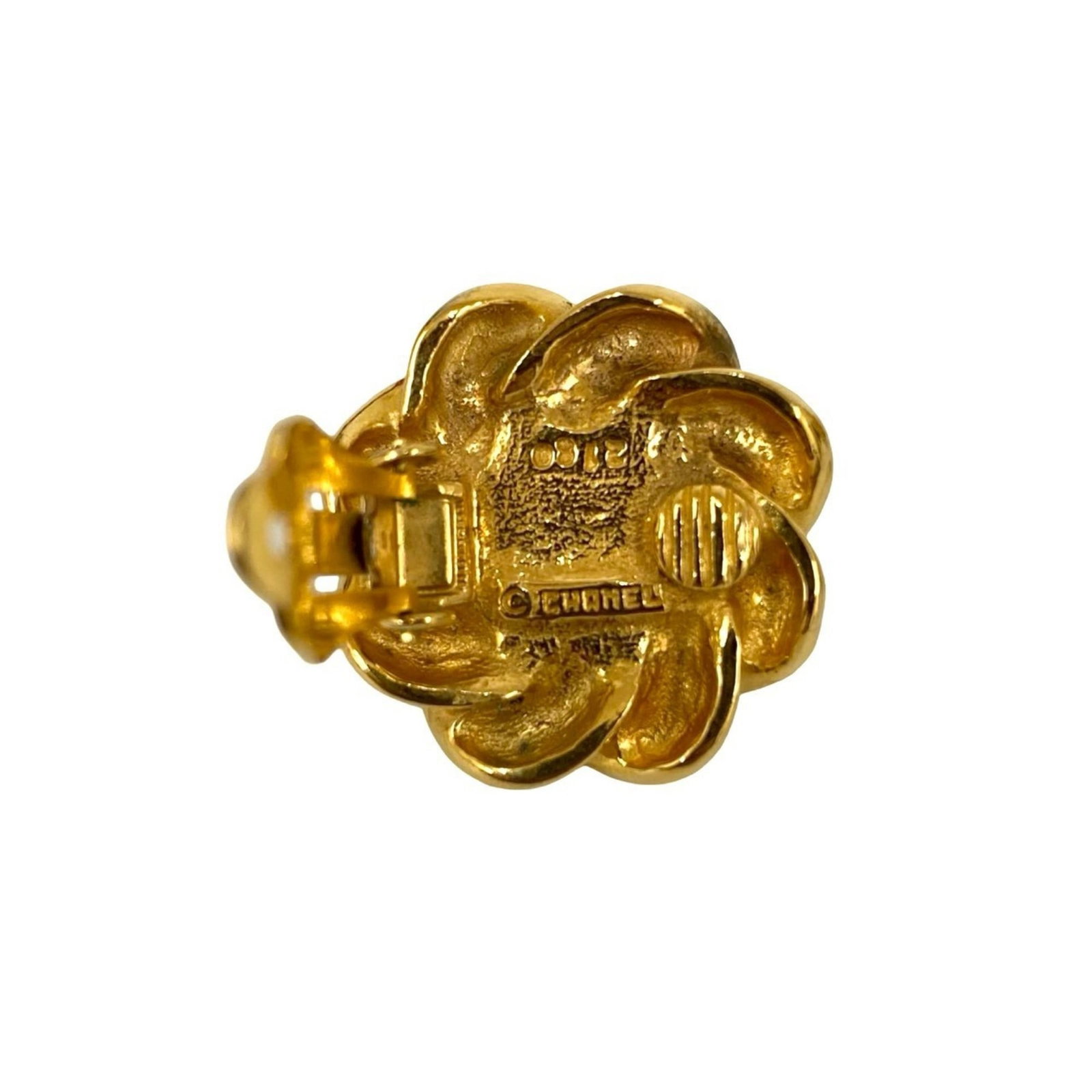 CHANEL Earcuff Gold Plating: CHANEL Earcuff Gold Plating Gold plating gives this CHANEL Earcuff a touch of luxury, while visible scratches and scuffs add a hint of wear and tear. The item bears a signature, but details about the